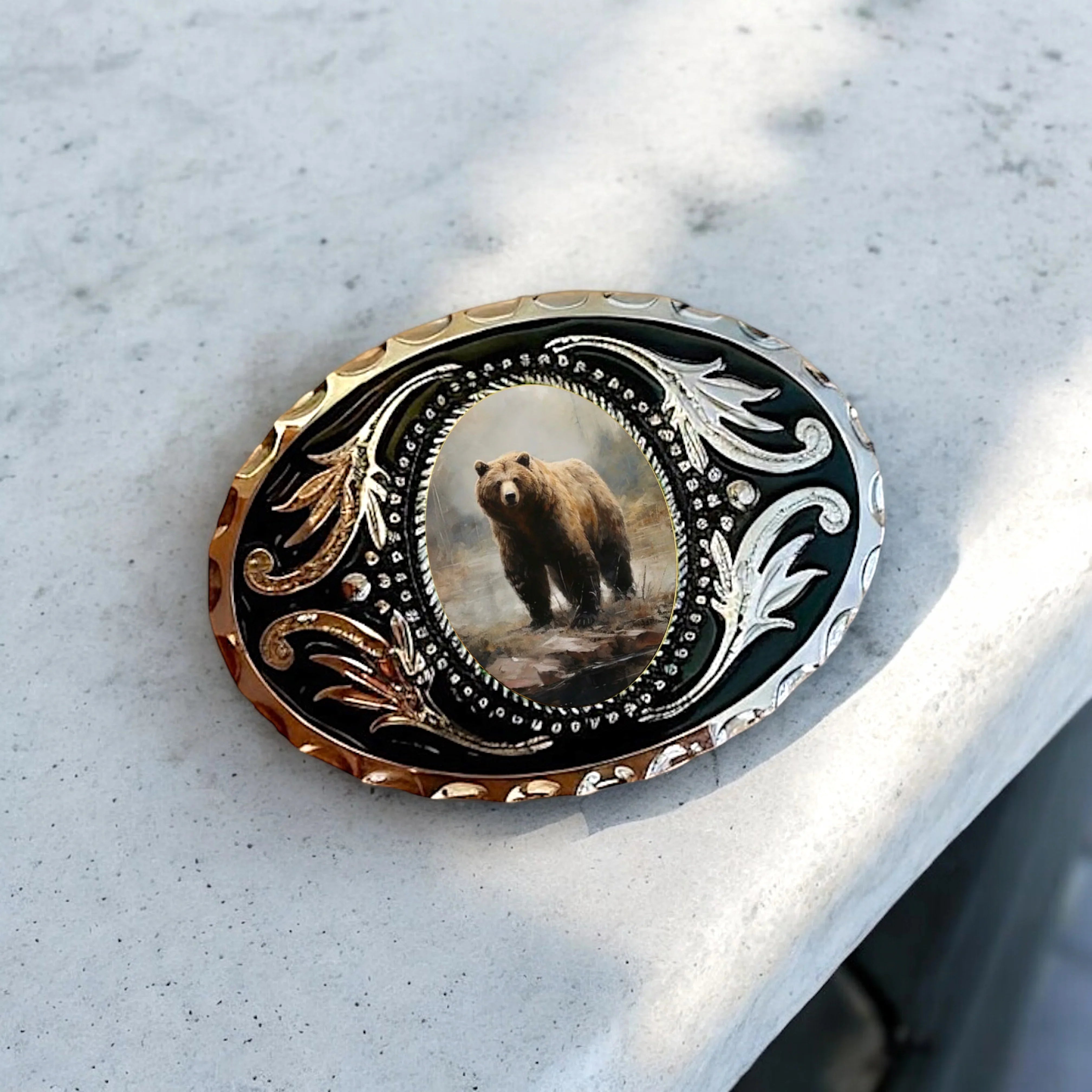 Two options for belt buckles: Option 1 has a leaf pattern and option 2 has flowers on it