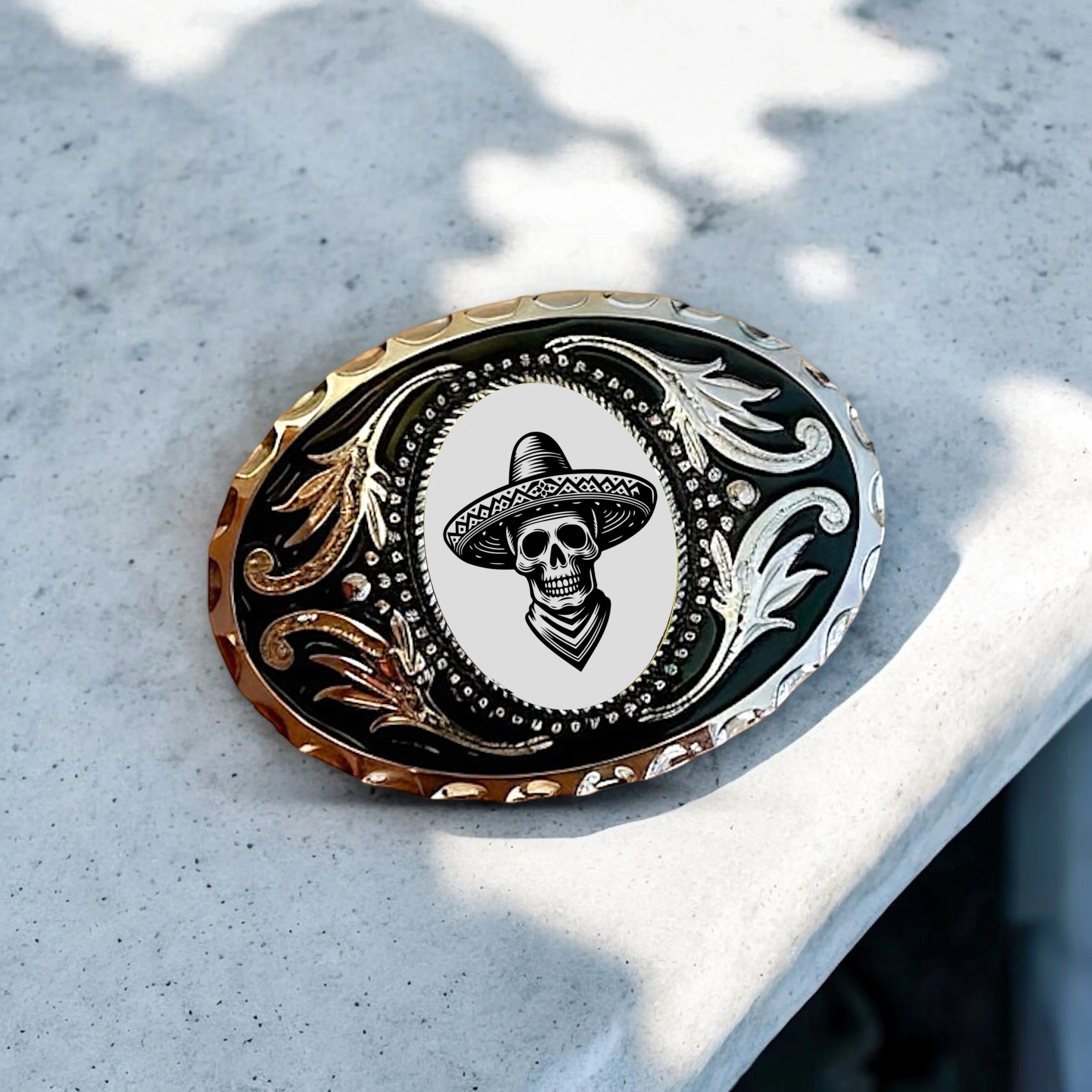 Two options for belt buckles: Option 1 has a leaf pattern and option 2 has flowers on it