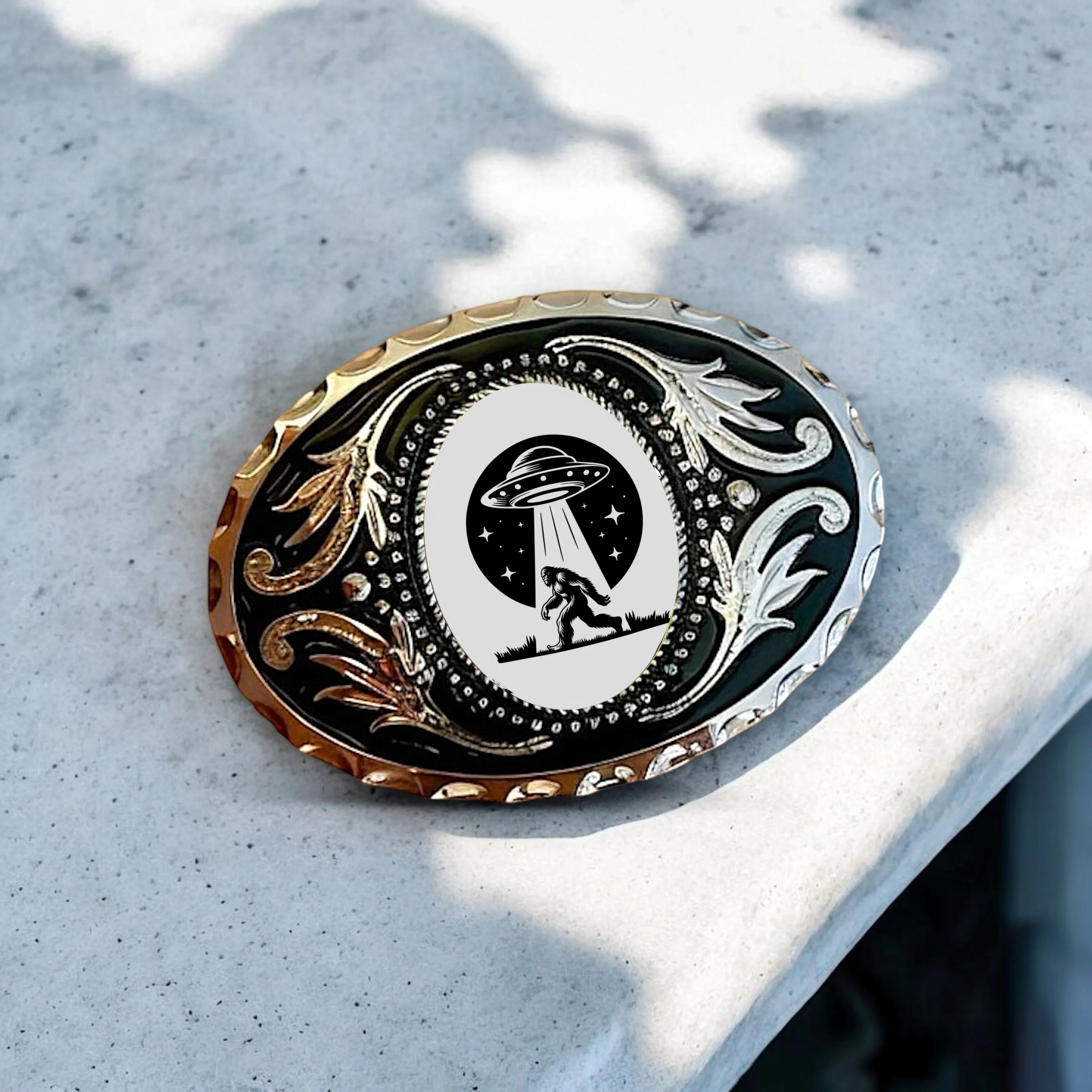 Two options for belt buckles: Option 1 has a leaf pattern and option 2 has flowers on it
