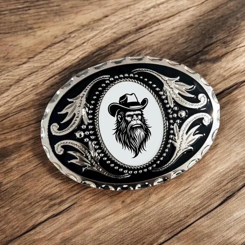 Bigfoot Belt Buckle Cowboy Accessory Western on a wooden table