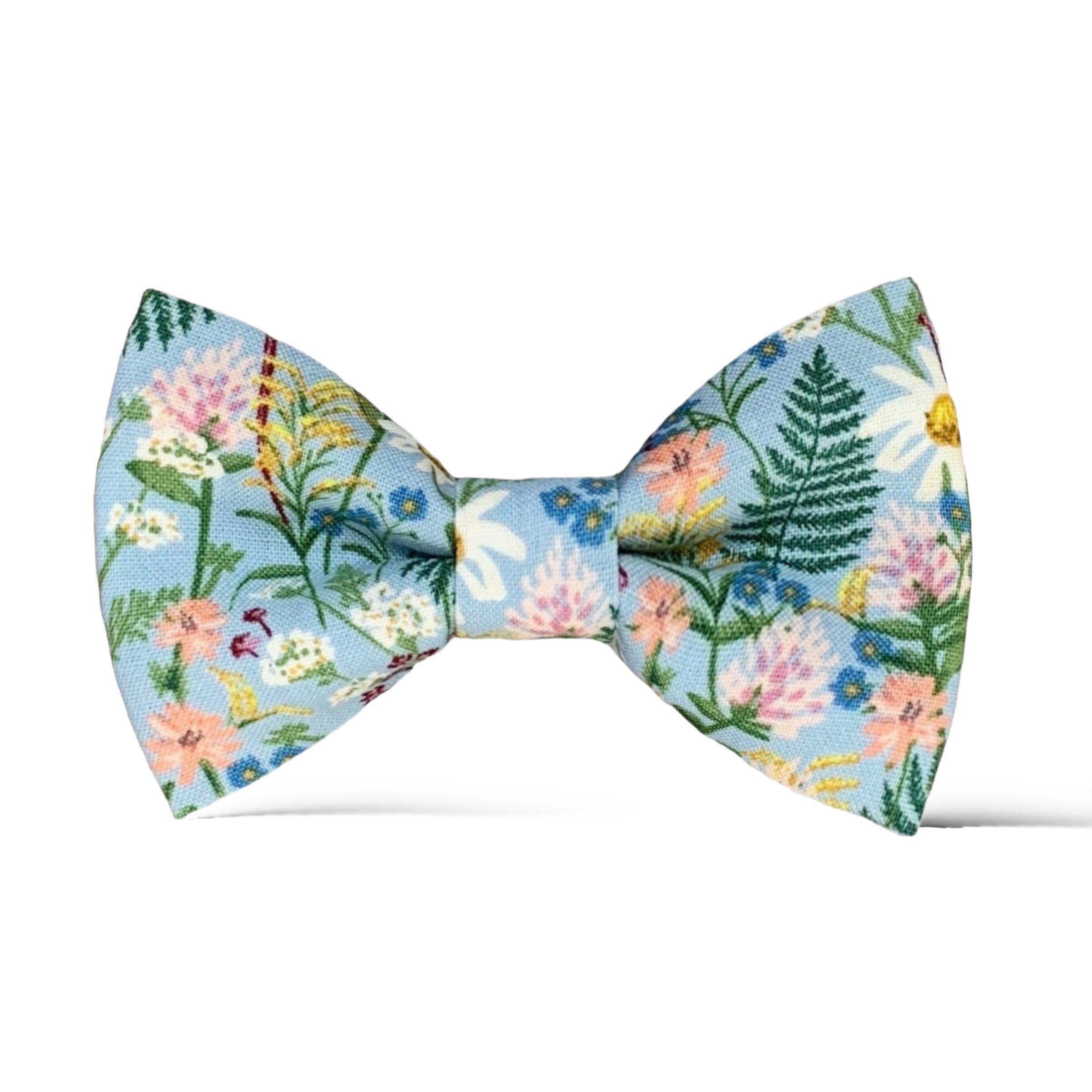 Wildflower Rifle Paper Co fabric Bow Tie in blue with white purple and pink flowers.