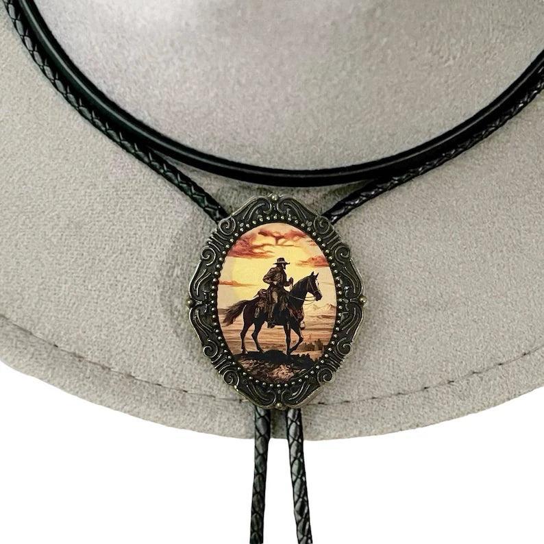 Back of a brass bolo tie with a clamp for the leather cord