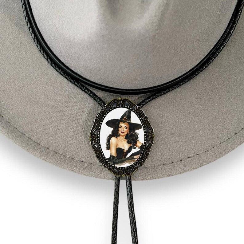 Back of a brass bolo tie with a clamp for the leather cord
