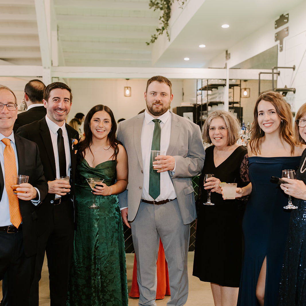 Emerald green men’s tie for wedding being worn by a wedding guest and friends.