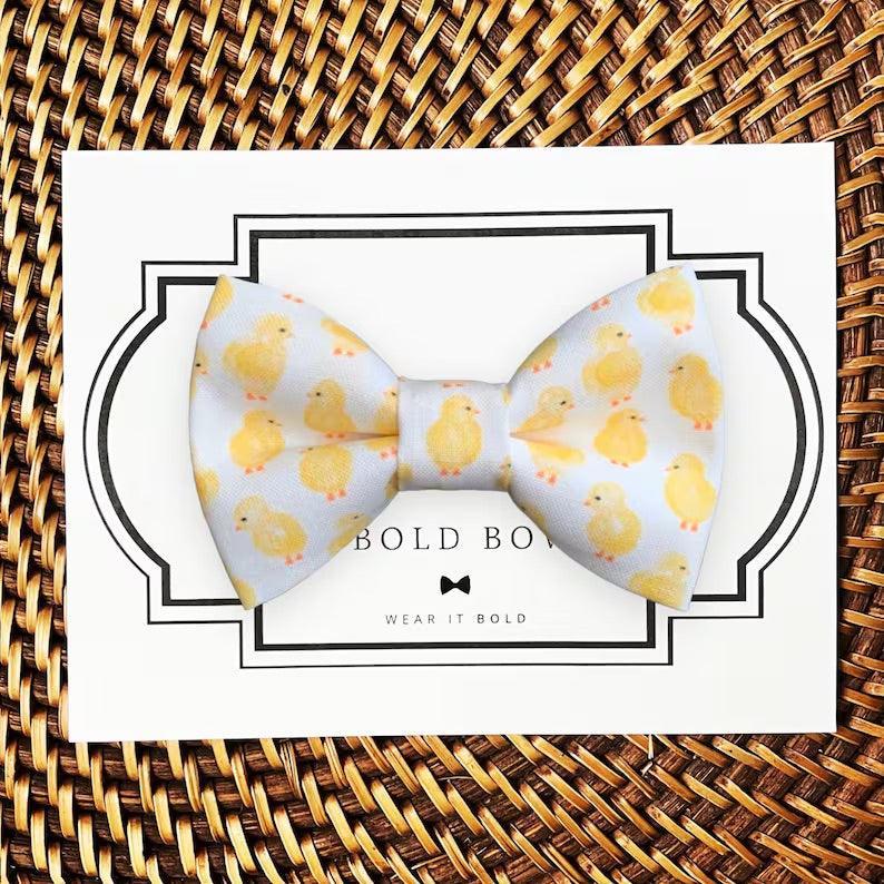 Dog bow tie size chart. Size Small is 3 1/2 inches wide for small dogs under 15 lbs. Size Medium is 4 inches wide for medium dogs between 15 band 40 lbs. Size Large is 4 1/2 inches wide for Large Dogs between 40 band 80 lbs. Size Extra Large is 5 1/2 inches wide for Extra Large Dogs over 80 lbs. Sizing is up to preference and pet bow ties slide on to dog collars with elastic.