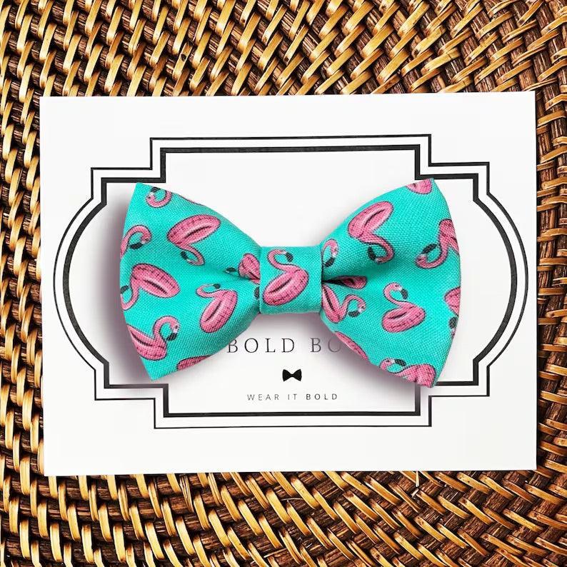 Dog bow tie size chart. Size Small is 3 1/2 inches wide for small dogs under 15 lbs. Size Medium is 4 inches wide for medium dogs between 15 band 40 lbs. Size Large is 4 1/2 inches wide for Large Dogs between 40 band 80 lbs. Size Extra Large is 5 1/2 inches wide for Extra Large Dogs over 80 lbs. Sizing is up to preference and pet bow ties slide on to dog collars with elastic.