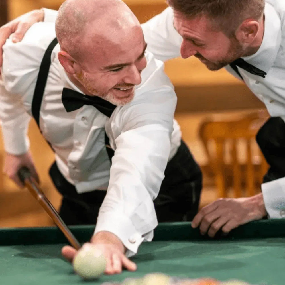Groom and best man in black bow ties