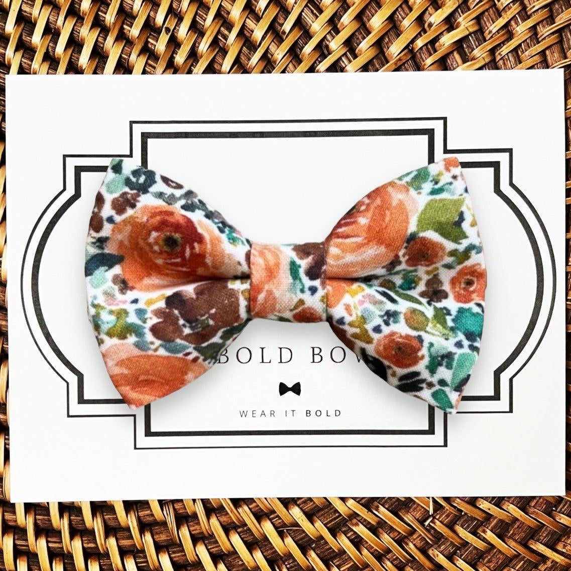 Dog bow tie size chart. Size Small is 3 1/2 inches wide for small dogs under 15 lbs. Size Medium is 4 inches wide for medium dogs between 15 band 40 lbs. Size Large is 4 1/2 inches wide for Large Dogs between 40 band 80 lbs. Size Extra Large is 5 1/2 inches wide for Extra Large Dogs over 80 lbs. Sizing is up to preference and pet bow ties slide on to dog collars with elastic.