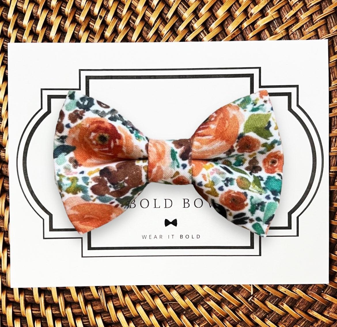 Dog bow tie size chart. Size Small is 3 1/2 inches wide for small dogs under 15 lbs. Size Medium is 4 inches wide for medium dogs between 15 band 40 lbs. Size Large is 4 1/2 inches wide for Large Dogs between 40 band 80 lbs. Size Extra Large is 5 1/2 inches wide for Extra Large Dogs over 80 lbs. Sizing is up to preference and pet bow ties slide on to dog collars with elastic.