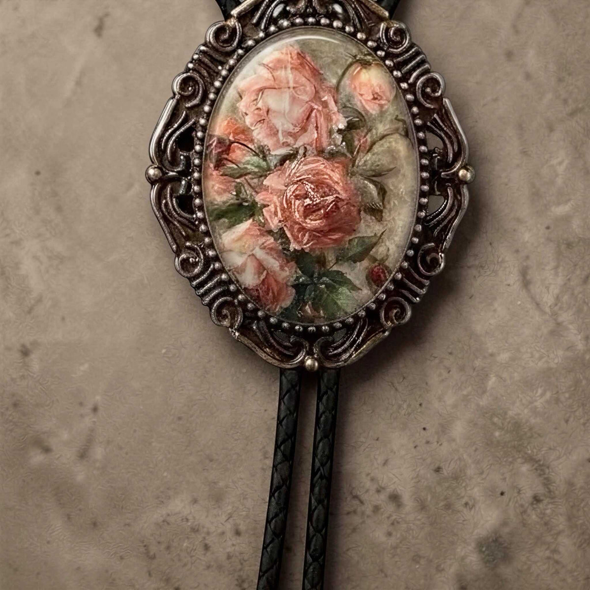Bohemian bolo tie with pink flowers.