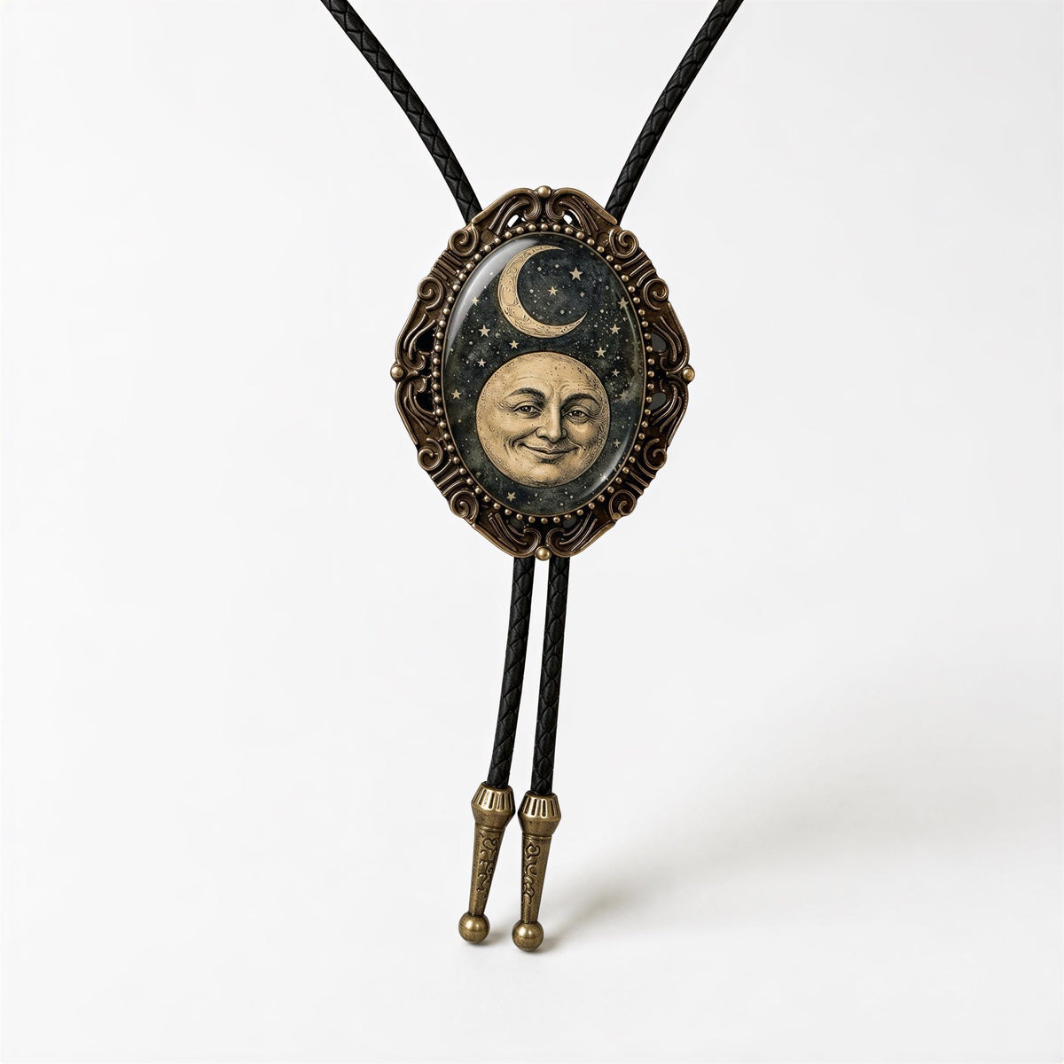 A decorative pendant featuring a moon and crescent symbol, with a smiling face, is displayed on a black cord.