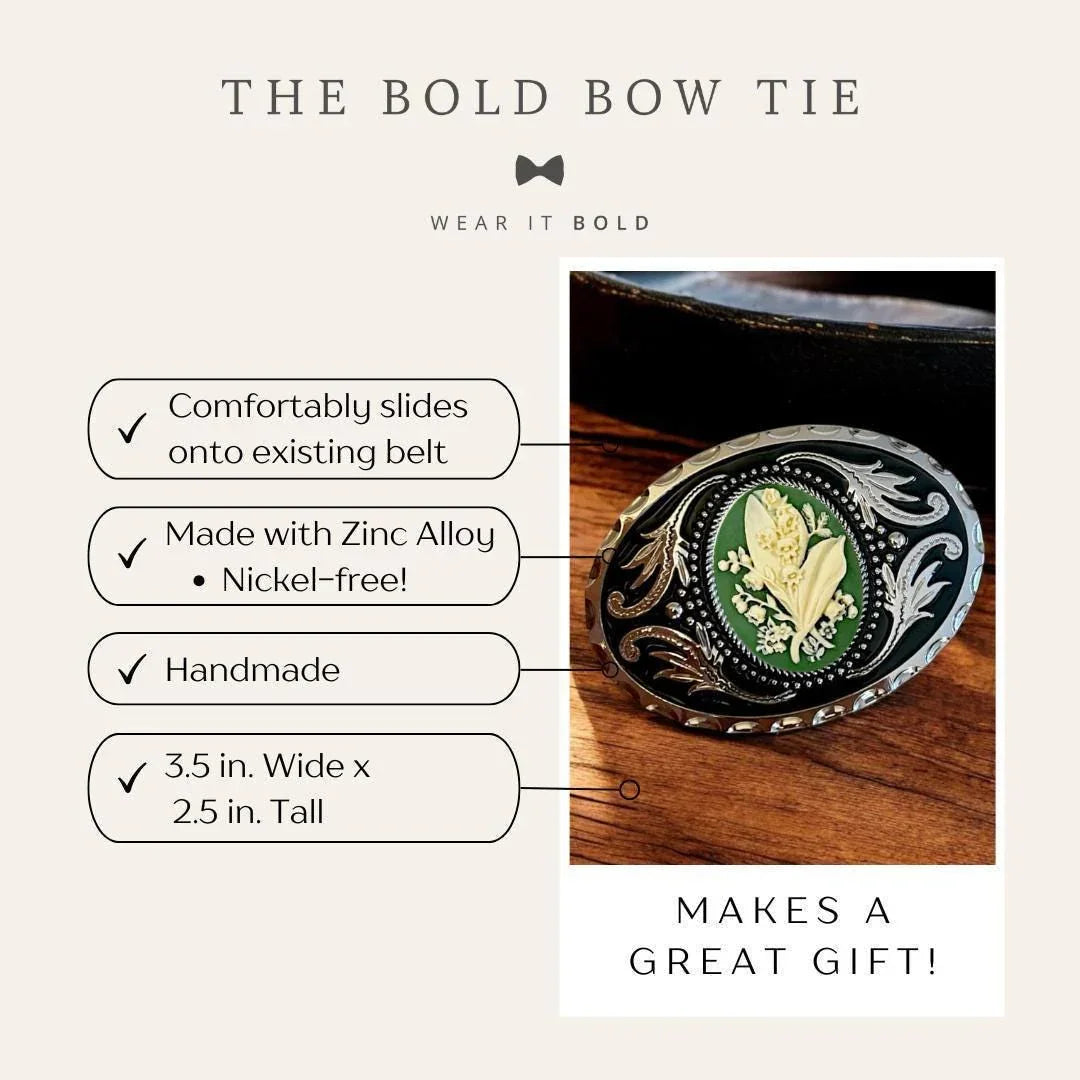 Belt buckle with lily of the valley design on a green background and ornate silver border