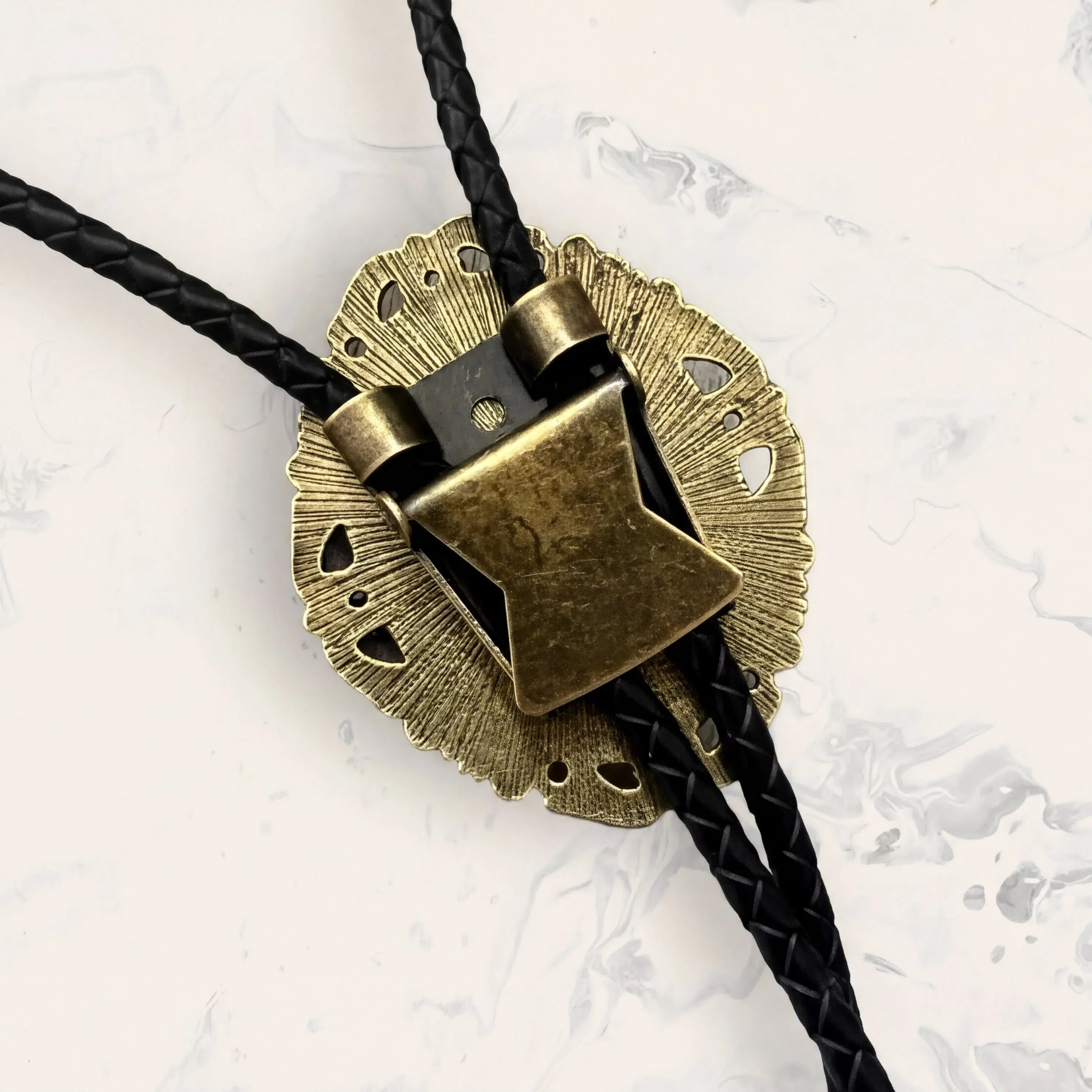 Back of bolo tie clasp on leather cord.