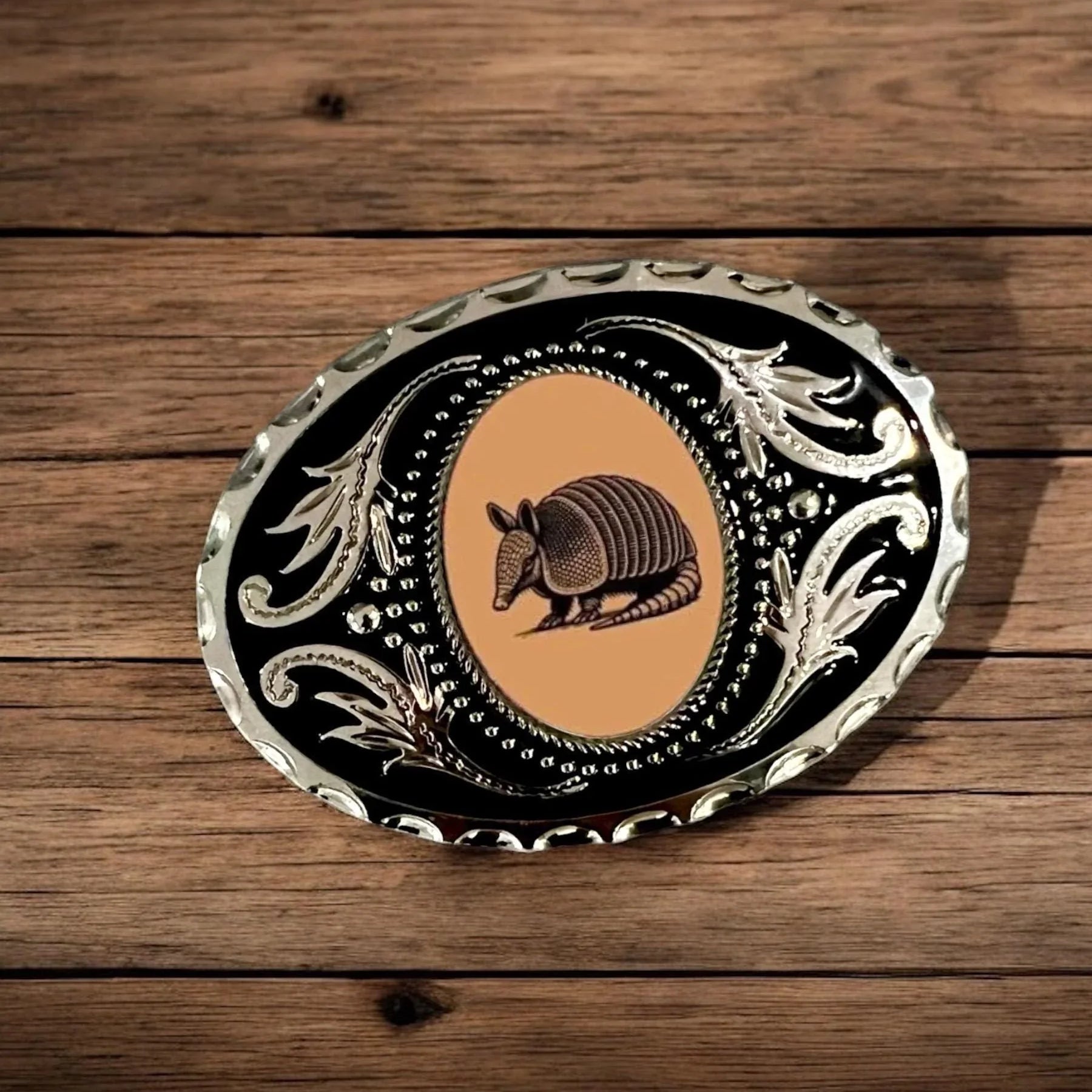 Two options for belt buckles: Option 1 has a leaf pattern and option 2 has flowers on it