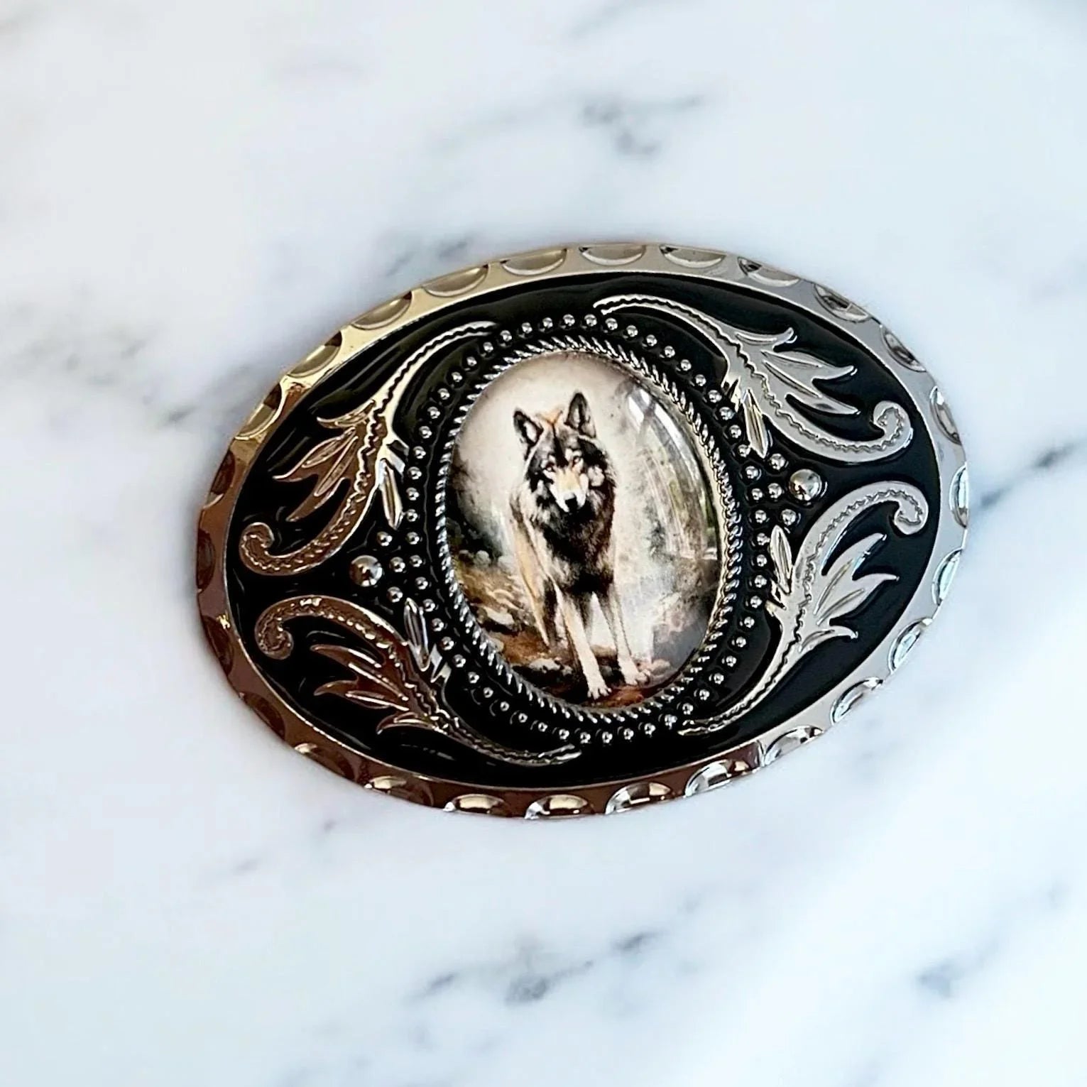 Gray wolf Belt Buckle Cowboy Accessory Western on marble table