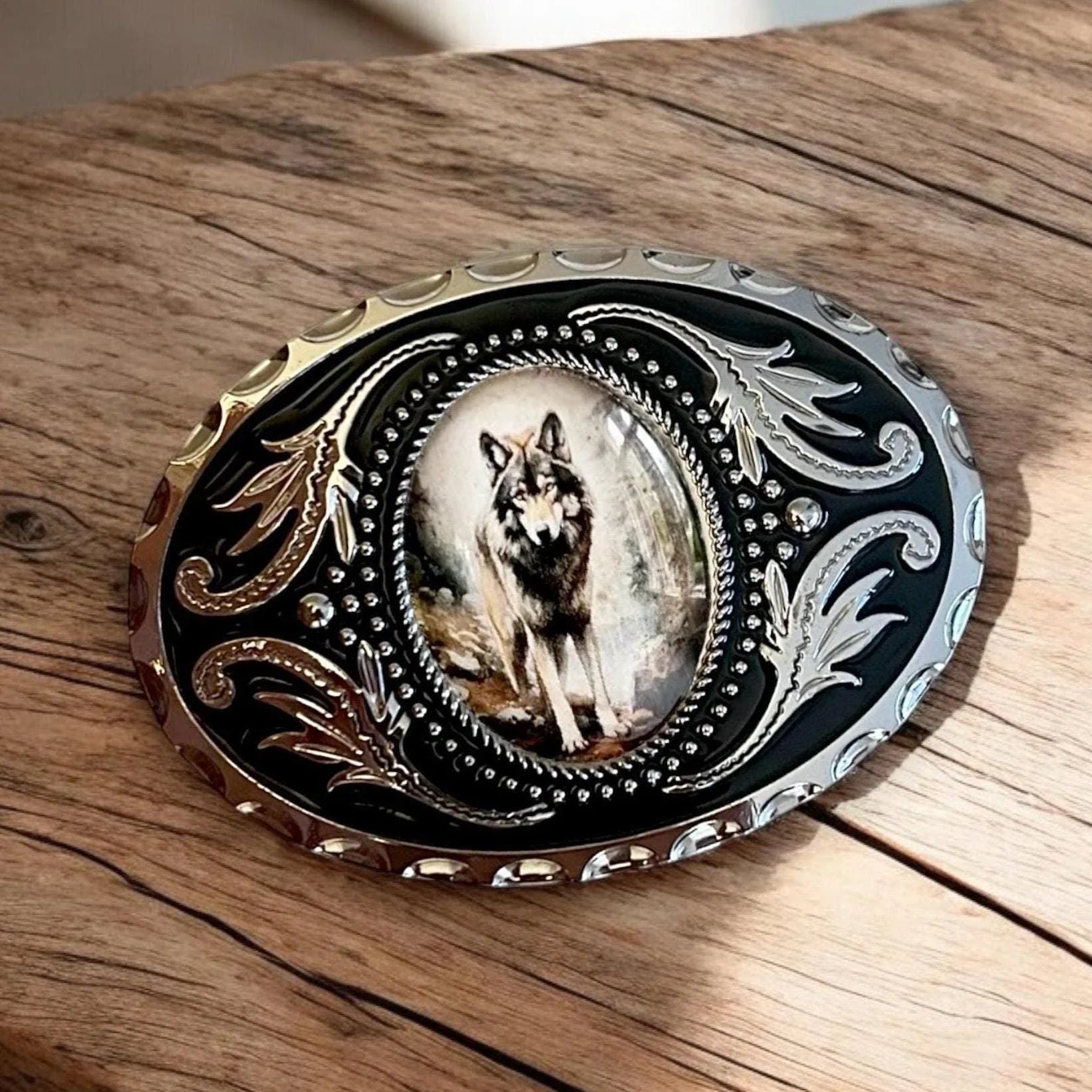 Two options for belt buckles: Option 1 has a leaf pattern and option 2 has flowers on it