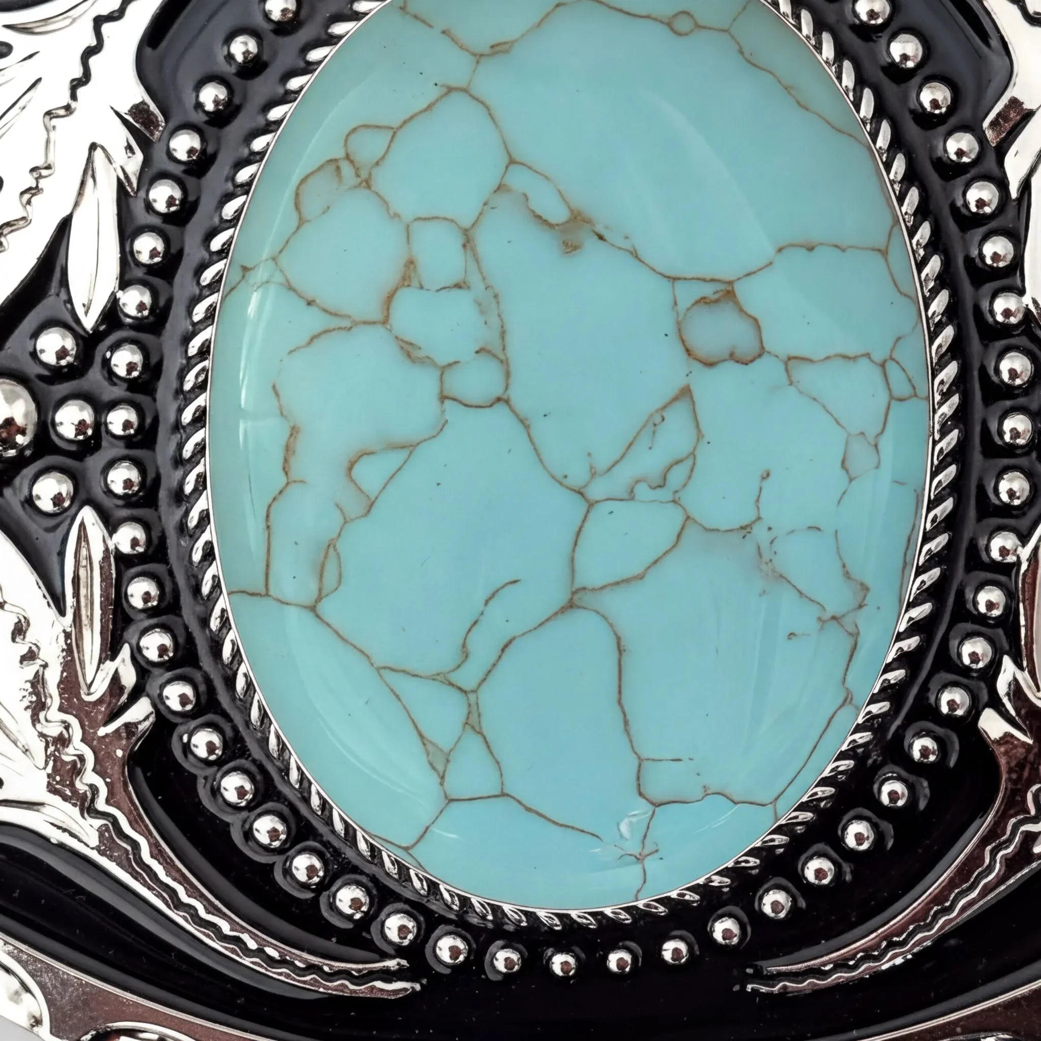 Two options for belt buckles: Option 1 has a leaf pattern and option 2 has flowers on it