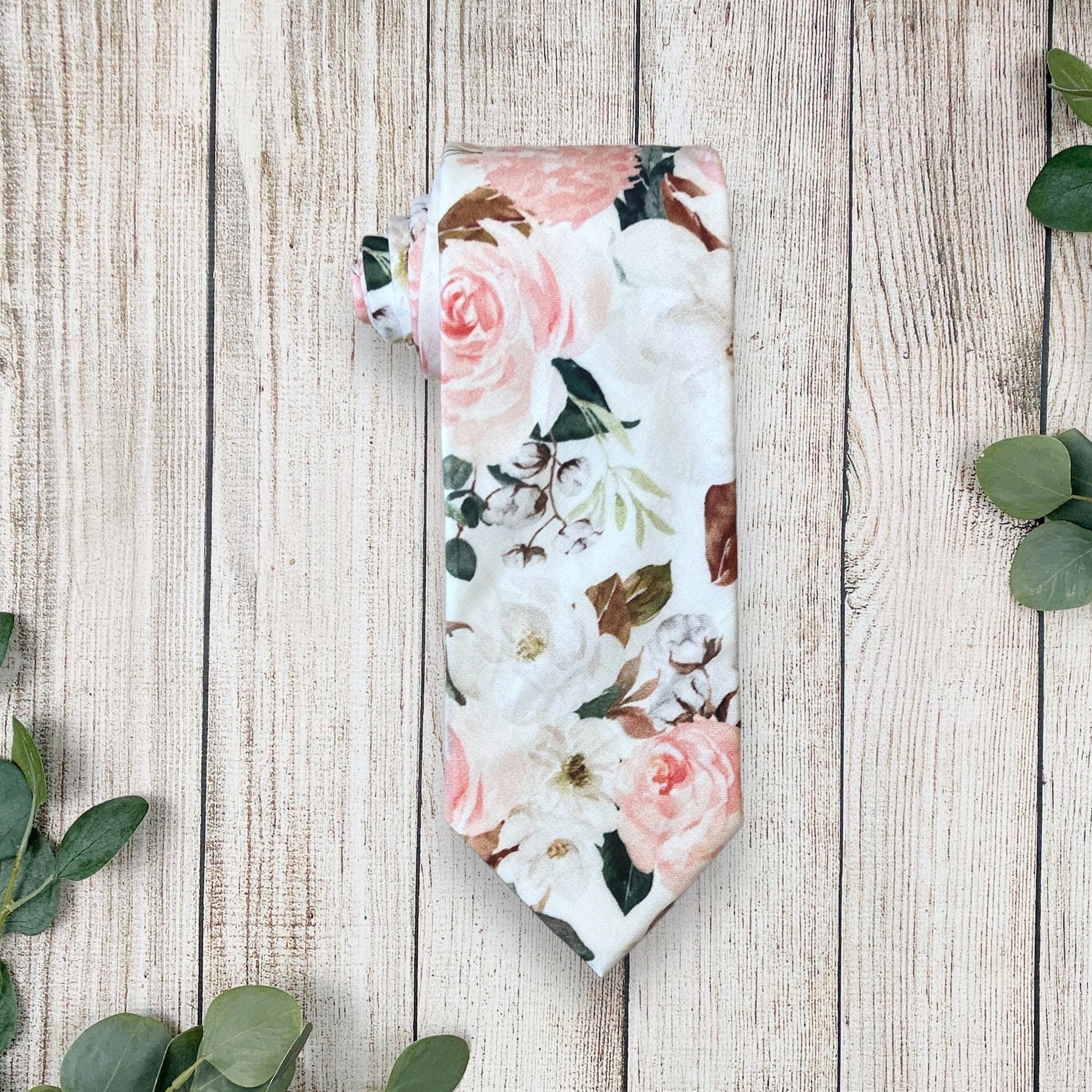 Blush and white floral men’s tie for wedding or special event.