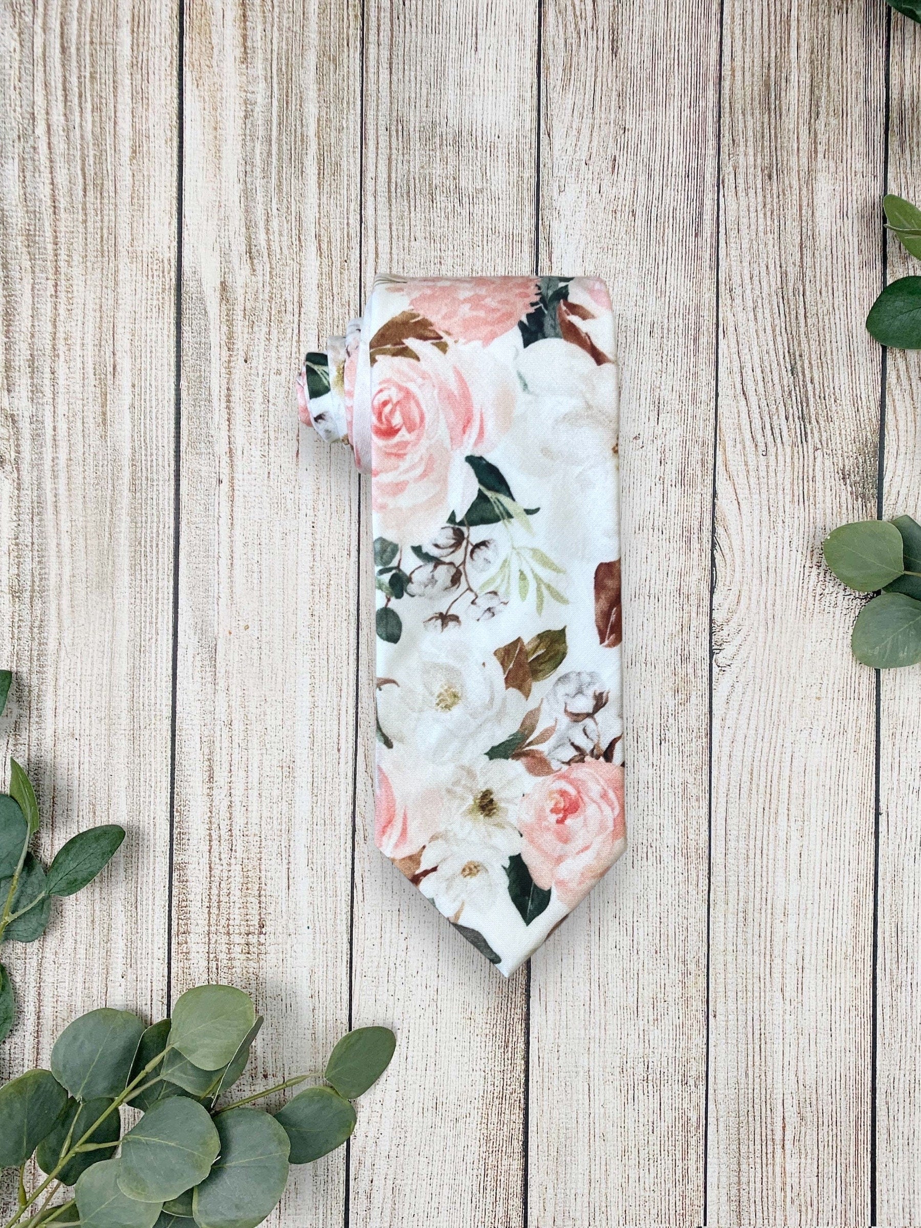 Blush and white floral men’s tie for wedding or special event.