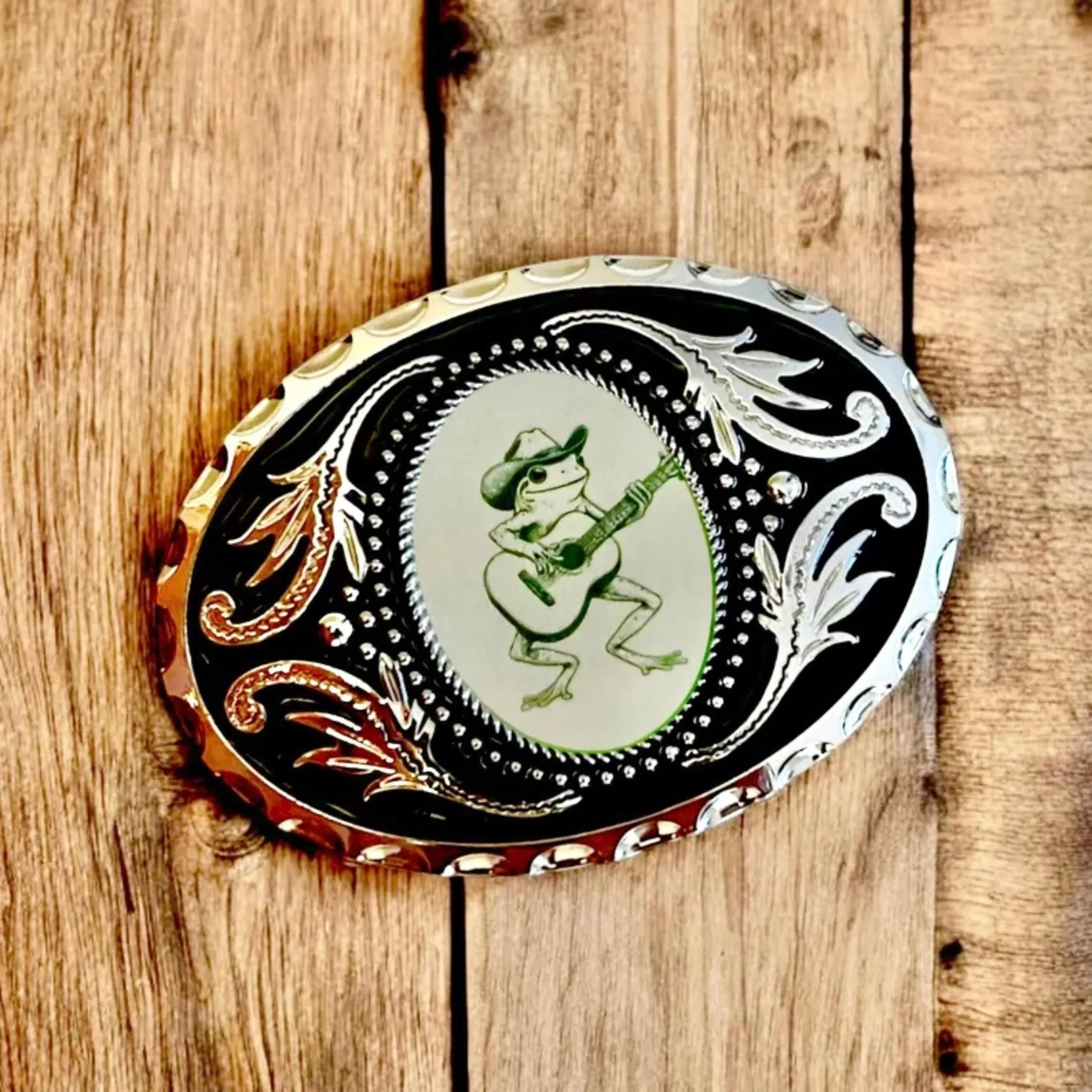 Two options for belt buckles: Option 1 has a leaf pattern and option 2 has flowers on it