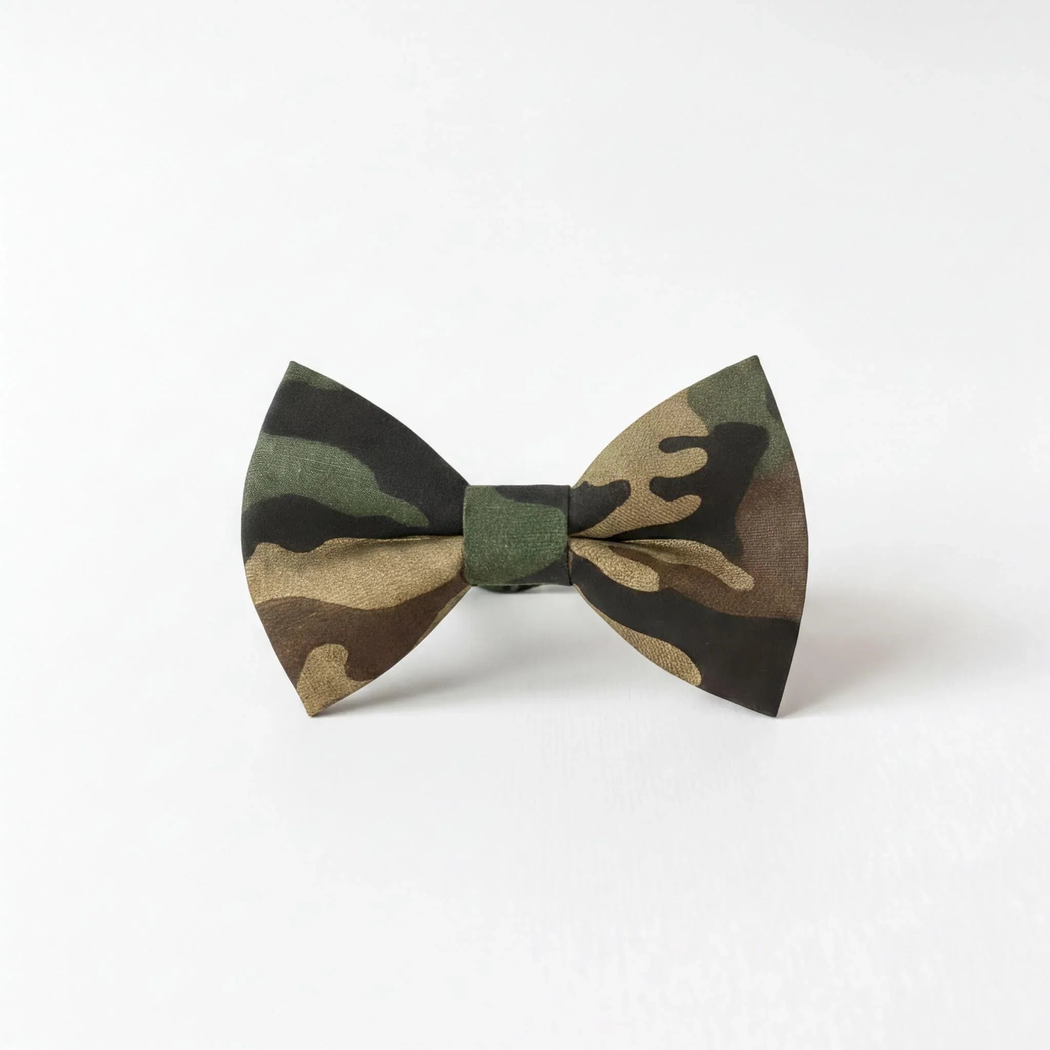 A camouflage bow tie with a dark green and brown pattern.