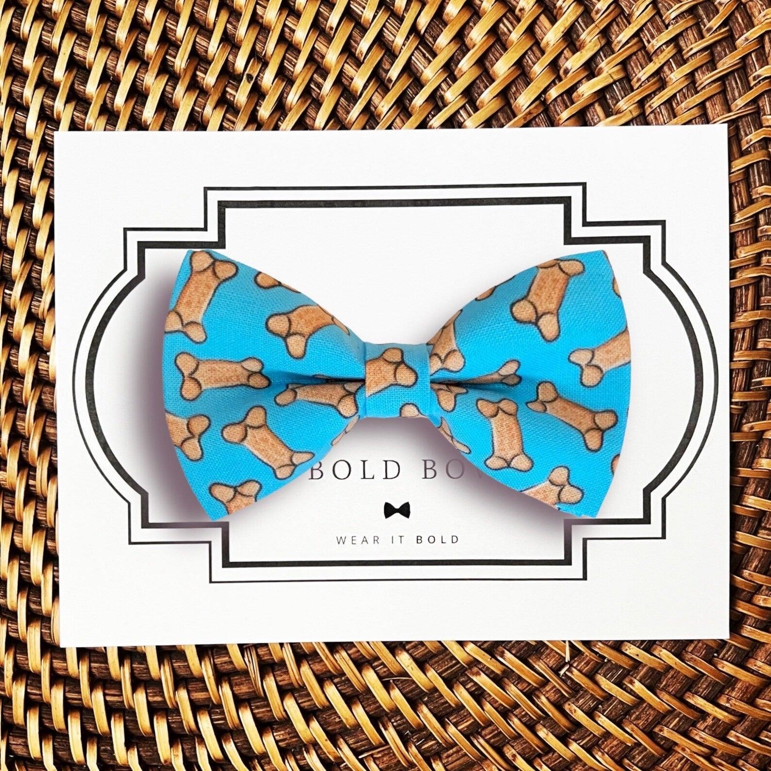 Dog bow tie size chart. Size Small is 3 1/2 inches wide for small dogs under 15 lbs. Size Medium is 4 inches wide for medium dogs between 15 band 40 lbs. Size Large is 4 1/2 inches wide for Large Dogs between 40 band 80 lbs. Size Extra Large is 5 1/2 inches wide for Extra Large Dogs over 80 lbs. Sizing is up to preference and pet bow ties slide on to dog collars with elastic.