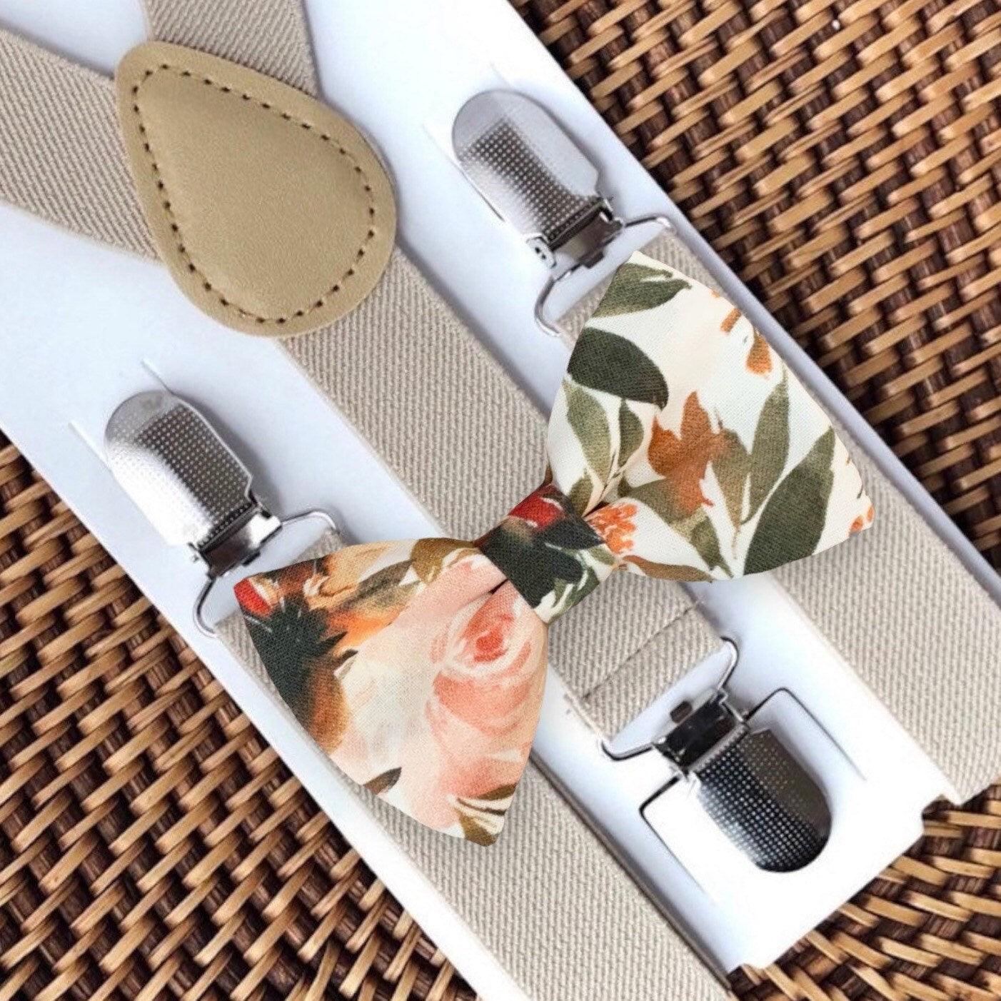 Floral terracotta bow tie and tan suspenders for wedding.