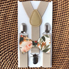 Floral terracotta bow tie and tan suspenders for wedding.