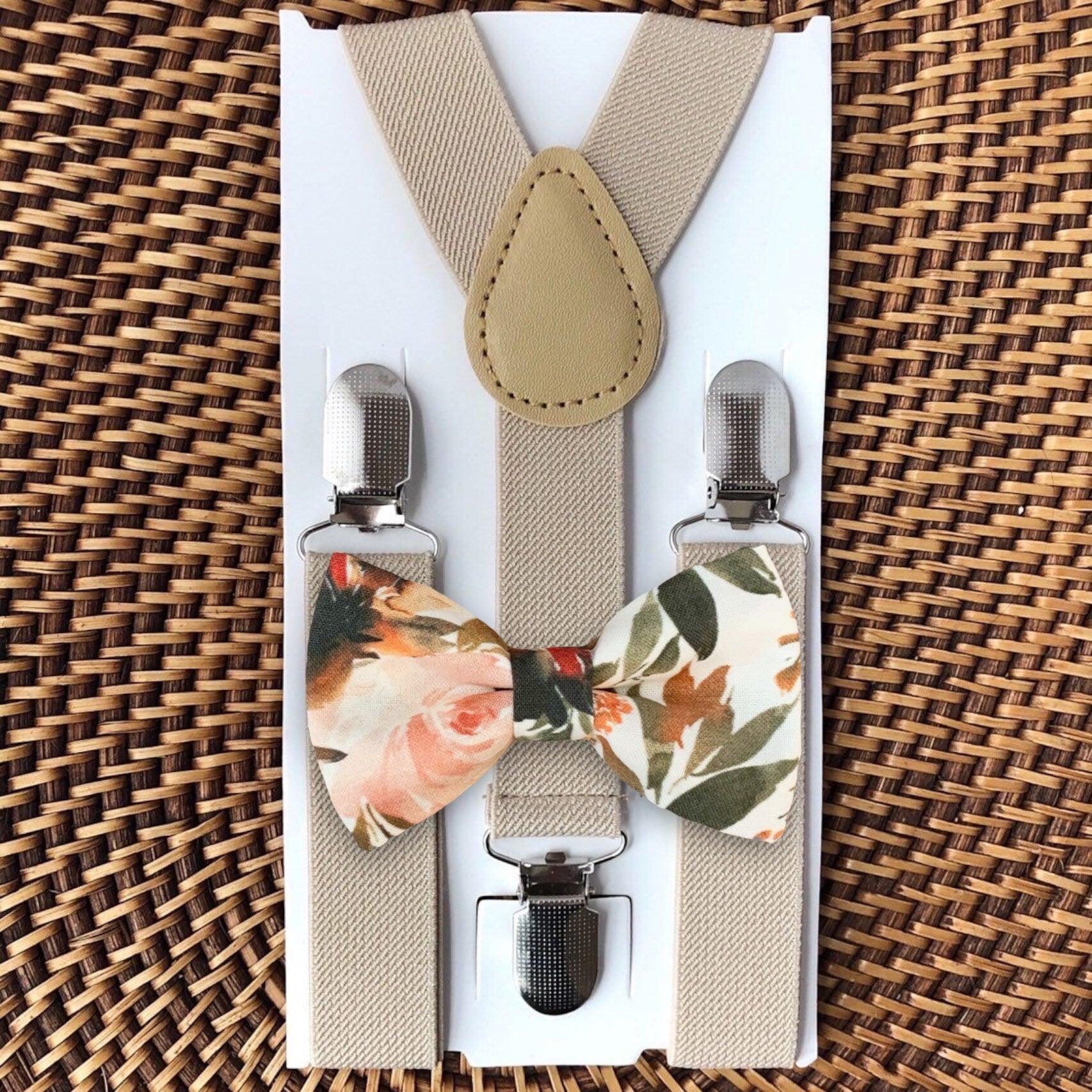 Floral terracotta bow tie and tan suspenders for wedding.