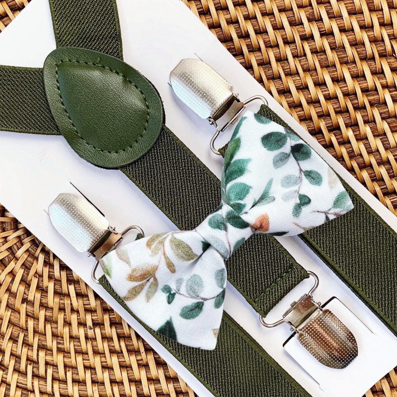 Floral bow tie and olive suspenders for wedding.