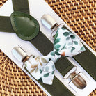 Floral bow tie and olive suspenders for wedding.