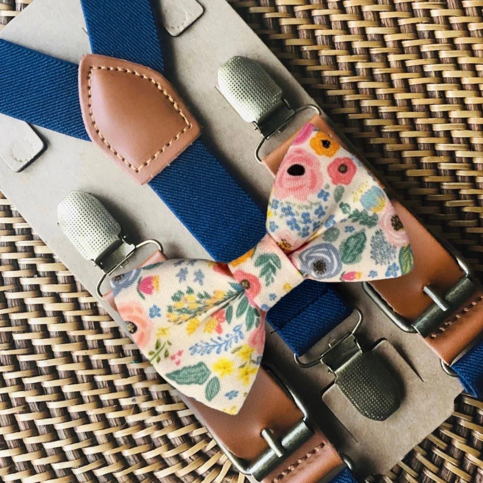 Wonderland Garden Bow Tie and Navy Suspenders Set displayed on a wooden surface