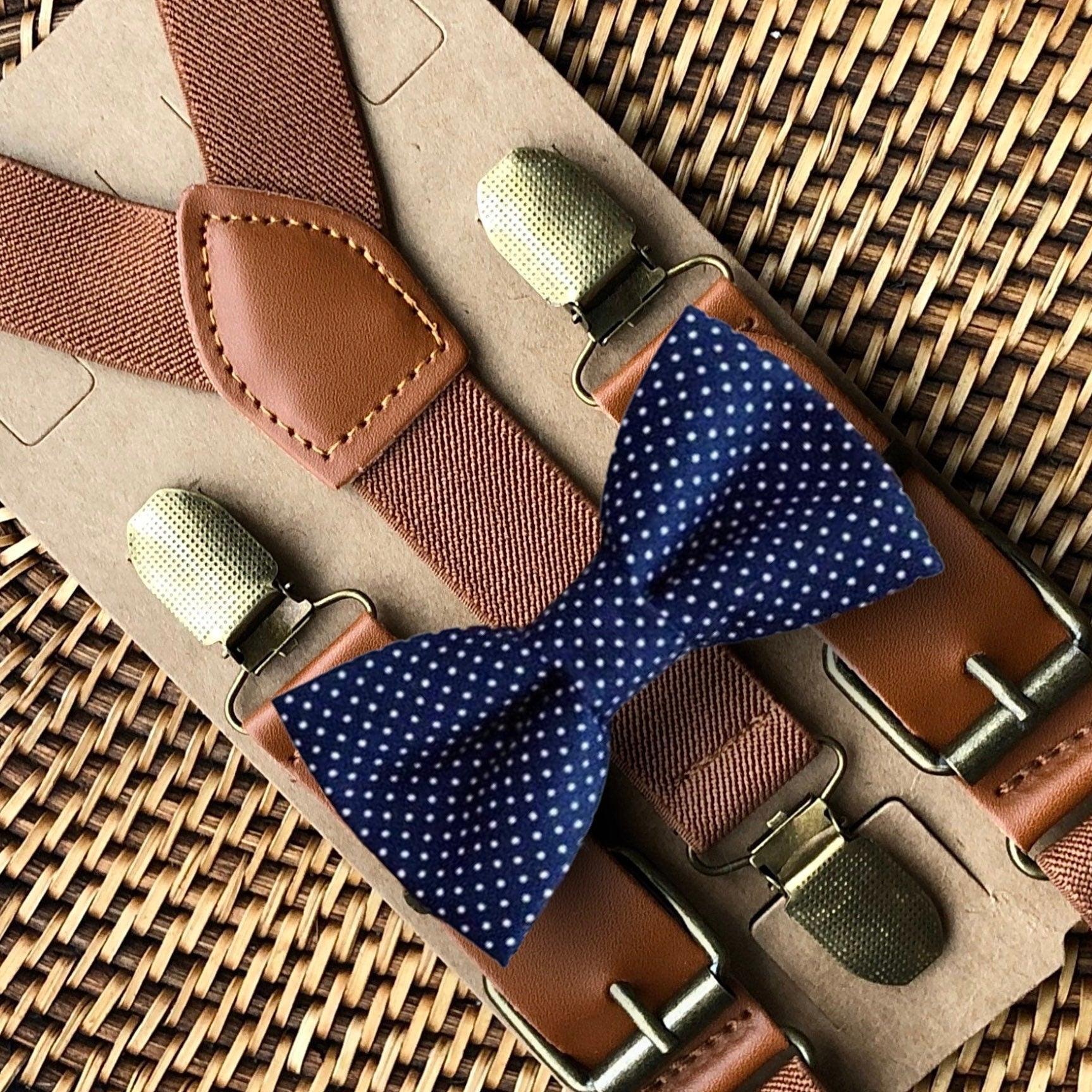 Size chart for suspender and bow tie sets from The Bold Bow Tie. X-Small (6mo-4yr): 15"-23" suspenders, 3.5" bow. Small (5-9yr): 18"-33" suspenders, 3.5" bow. Medium (10-12yr): 18"-33" suspenders, 4" bow. Adult (13yr-6'5"): 30"-53" suspenders, 4.5" bow. Big & Tall (Over 6'5"): 53"+ suspenders, 4.5" bow. Instructions note to measure from the back waistband over the shoulder to the front waistband for a comfortable fit.