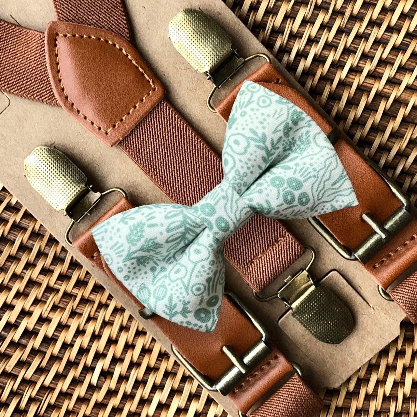 Size chart for suspender and bow tie sets from The Bold Bow Tie. X-Small (6mo-4yr): 15"-23" suspenders, 3.5" bow. Small (5-9yr): 18"-33" suspenders, 3.5" bow. Medium (10-12yr): 18"-33" suspenders, 4" bow. Adult (13yr-6'5"): 30"-53" suspenders, 4.5" bow. Big & Tall (Over 6'5"): 53"+ suspenders, 4.5" bow. Instructions note to measure from the back waistband over the shoulder to the front waistband for a comfortable fit.