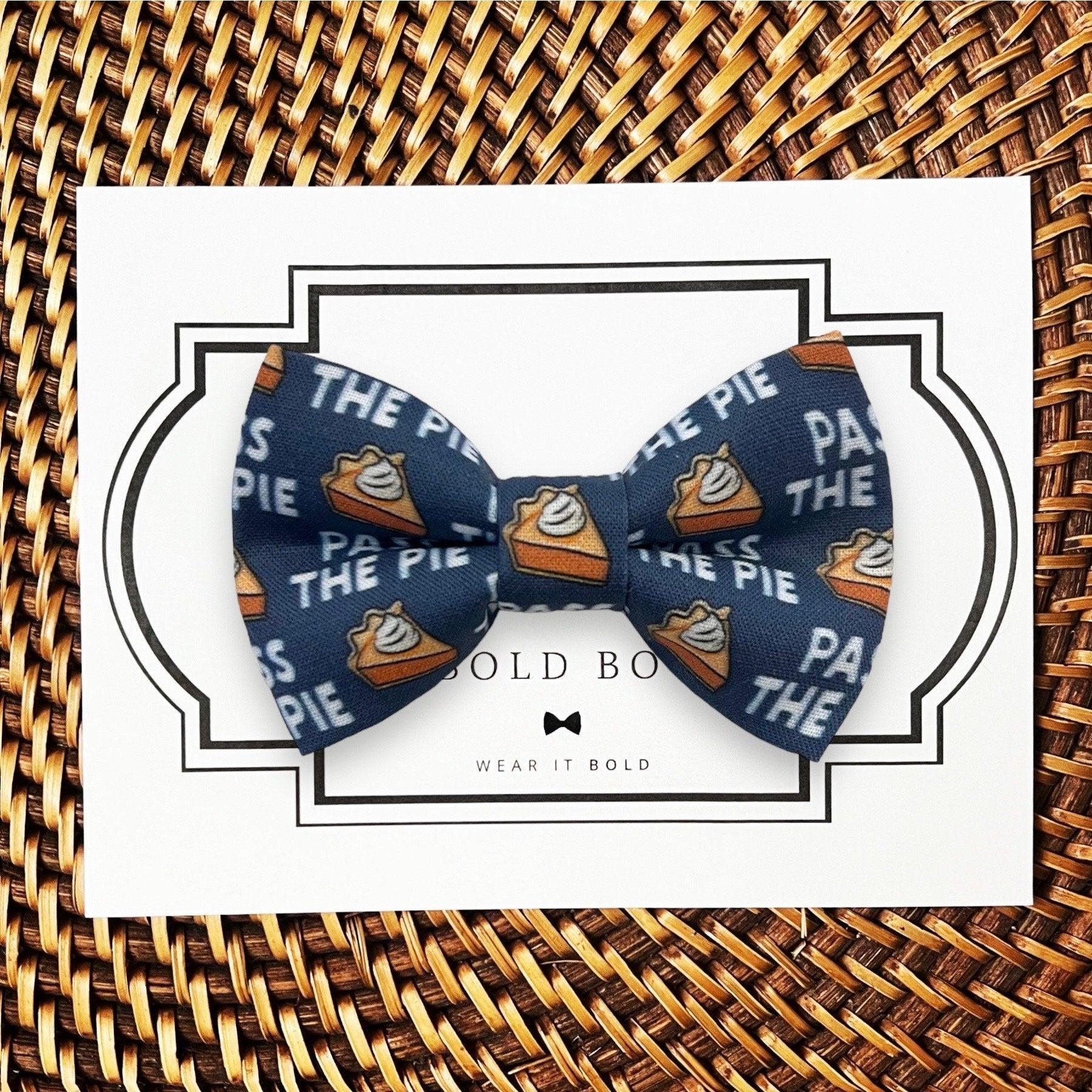 Dog bow tie size chart. Size Small is 3 1/2 inches wide for small dogs under 15 lbs. Size Medium is 4 inches wide for medium dogs between 15 band 40 lbs. Size Large is 4 1/2 inches wide for Large Dogs between 40 band 80 lbs. Size Extra Large is 5 1/2 inches wide for Extra Large Dogs over 80 lbs. Sizing is up to preference and pet bow ties slide on to dog collars with elastic.