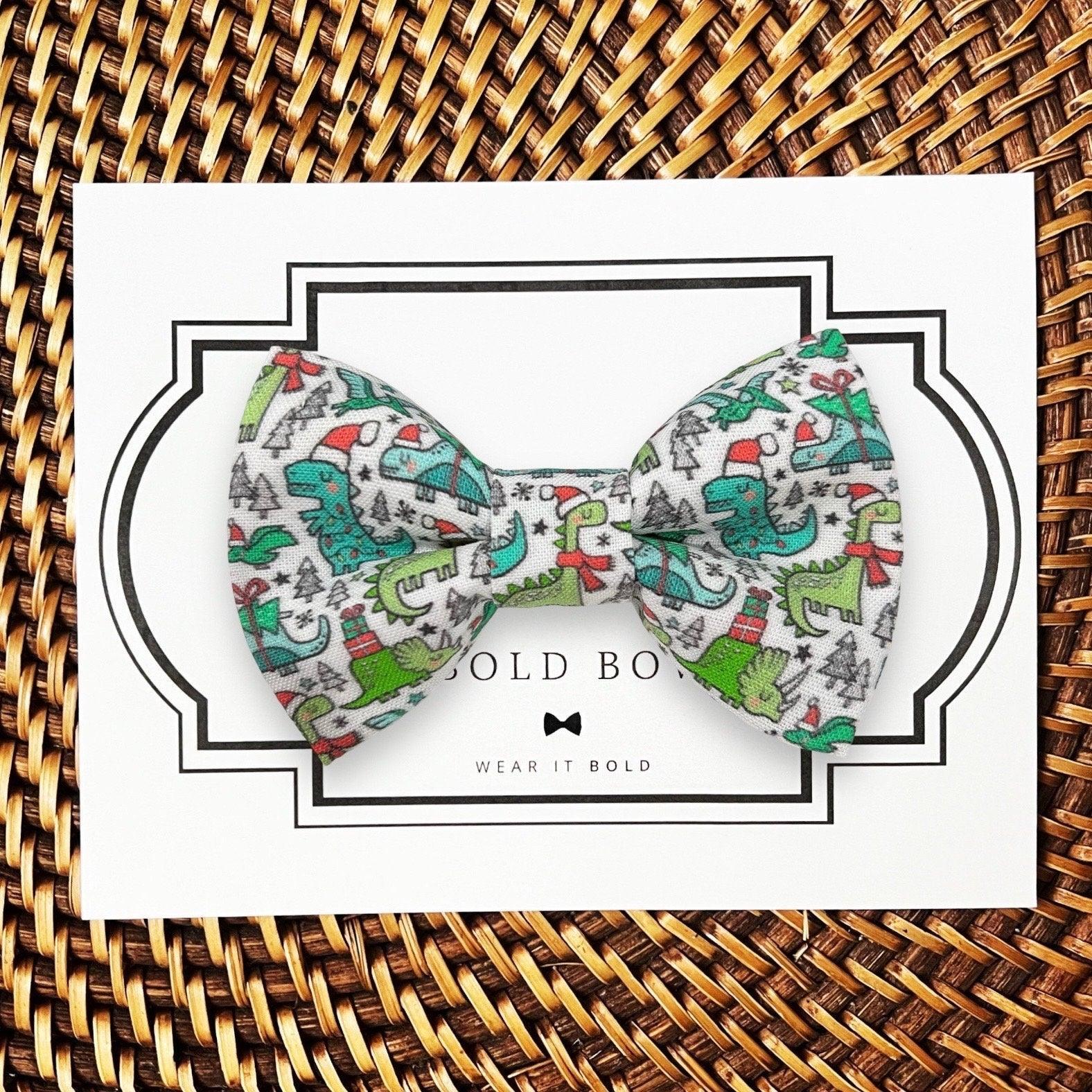 Dog bow tie size chart. Size Small is 3 1/2 inches wide for small dogs under 15 lbs. Size Medium is 4 inches wide for medium dogs between 15 band 40 lbs. Size Large is 4 1/2 inches wide for Large Dogs between 40 band 80 lbs. Size Extra Large is 5 1/2 inches wide for Extra Large Dogs over 80 lbs. Sizing is up to preference and pet bow ties slide on to dog collars with elastic.