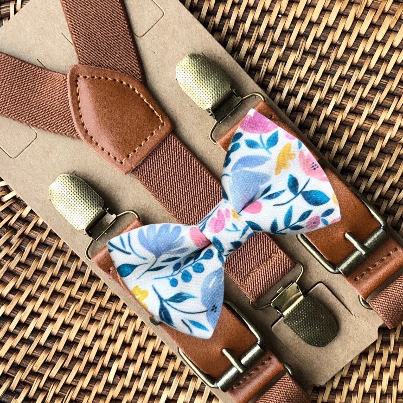 Size chart for suspender and bow tie sets from The Bold Bow Tie. X-Small (6mo-4yr): 15"-23" suspenders, 3.5" bow. Small (5-9yr): 18"-33" suspenders, 3.5" bow. Medium (10-12yr): 18"-33" suspenders, 4" bow. Adult (13yr-6'5"): 30"-53" suspenders, 4.5" bow. Big & Tall (Over 6'5"): 53"+ suspenders, 4.5" bow. Instructions note to measure from the back waistband over the shoulder to the front waistband for a comfortable fit.