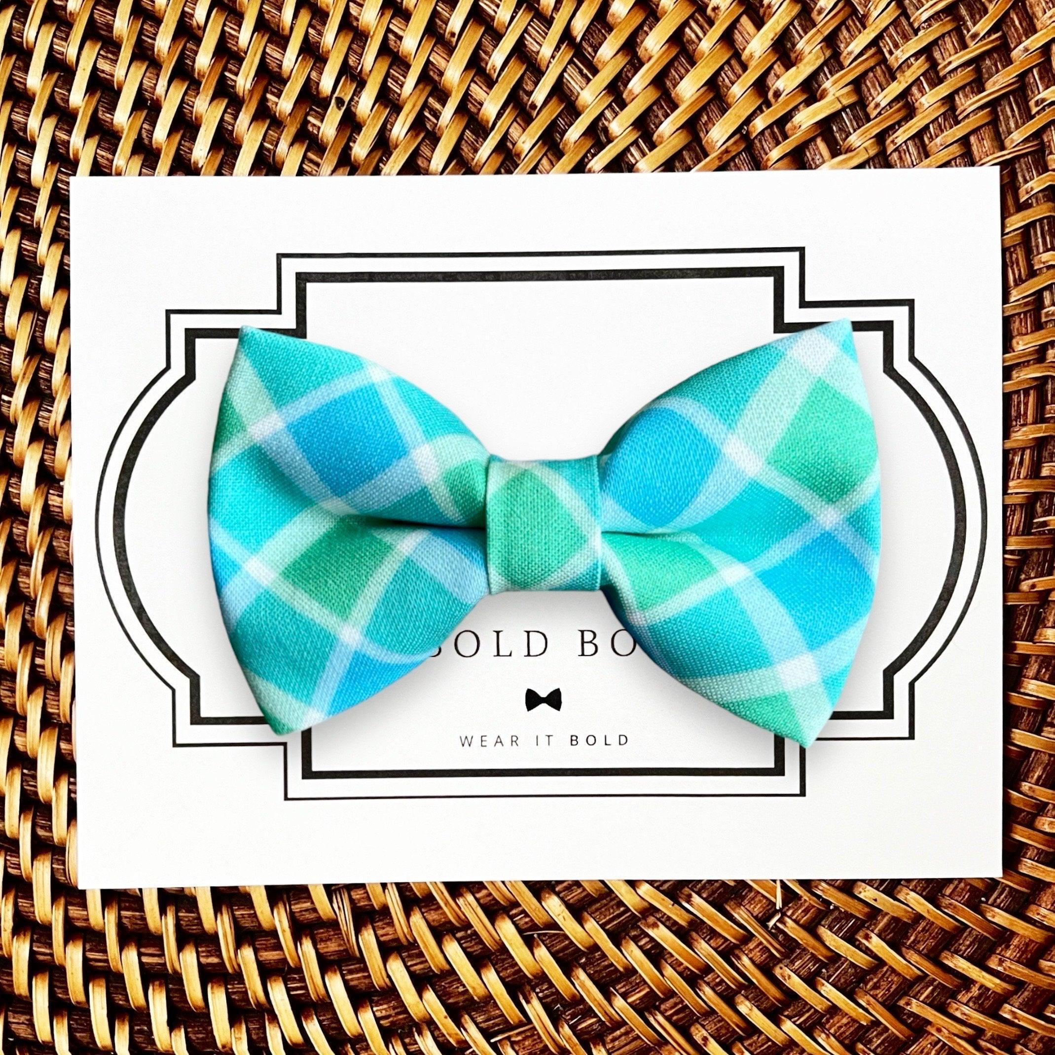 Dog bow tie size chart. Size Small is 3 1/2 inches wide for small dogs under 15 lbs. Size Medium is 4 inches wide for medium dogs between 15 band 40 lbs. Size Large is 4 1/2 inches wide for Large Dogs between 40 band 80 lbs. Size Extra Large is 5 1/2 inches wide for Extra Large Dogs over 80 lbs. Sizing is up to preference and pet bow ties slide on to dog collars with elastic.