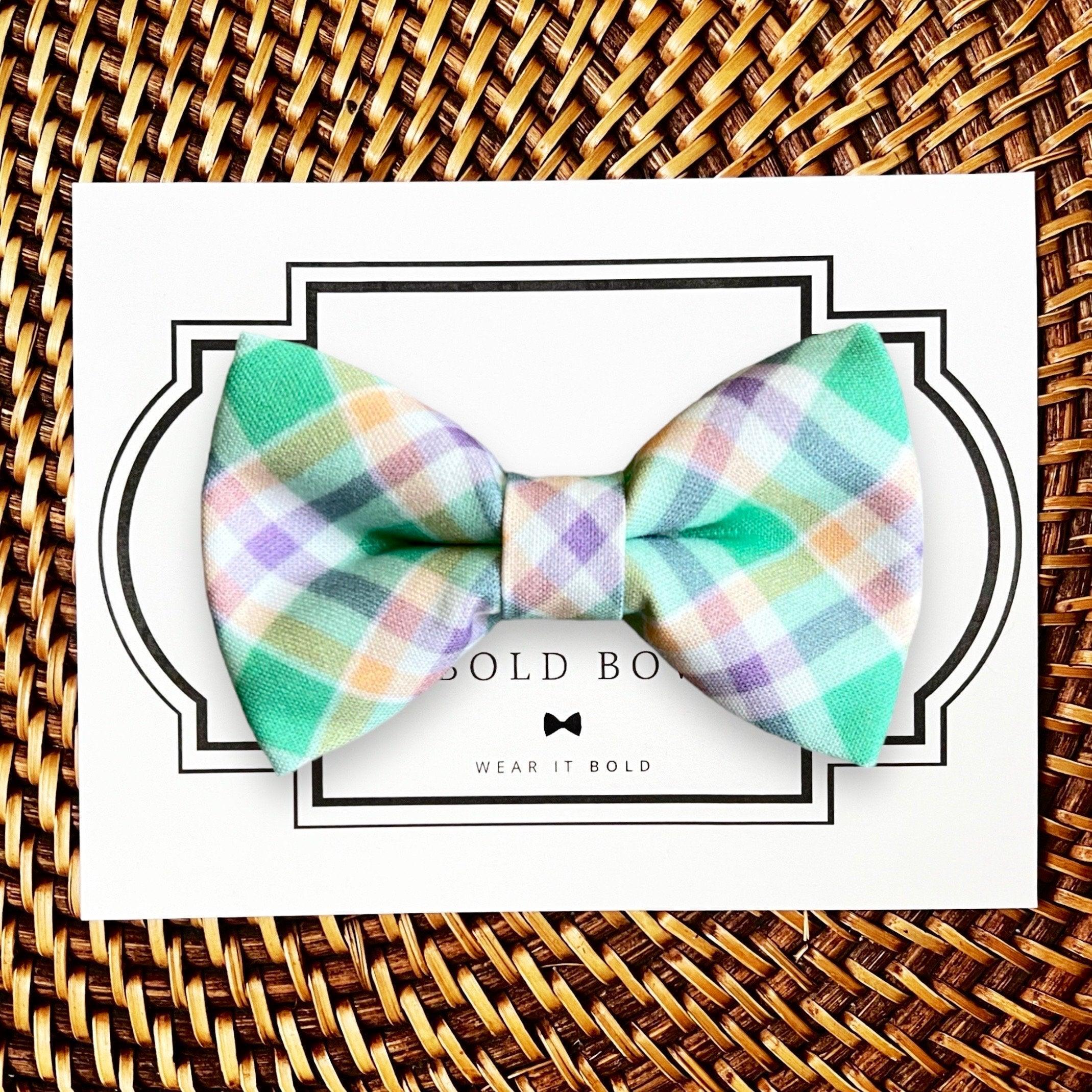 Dog bow tie size chart. Size Small is 3 1/2 inches wide for small dogs under 15 lbs. Size Medium is 4 inches wide for medium dogs between 15 band 40 lbs. Size Large is 4 1/2 inches wide for Large Dogs between 40 band 80 lbs. Size Extra Large is 5 1/2 inches wide for Extra Large Dogs over 80 lbs. Sizing is up to preference and pet bow ties slide on to dog collars with elastic.