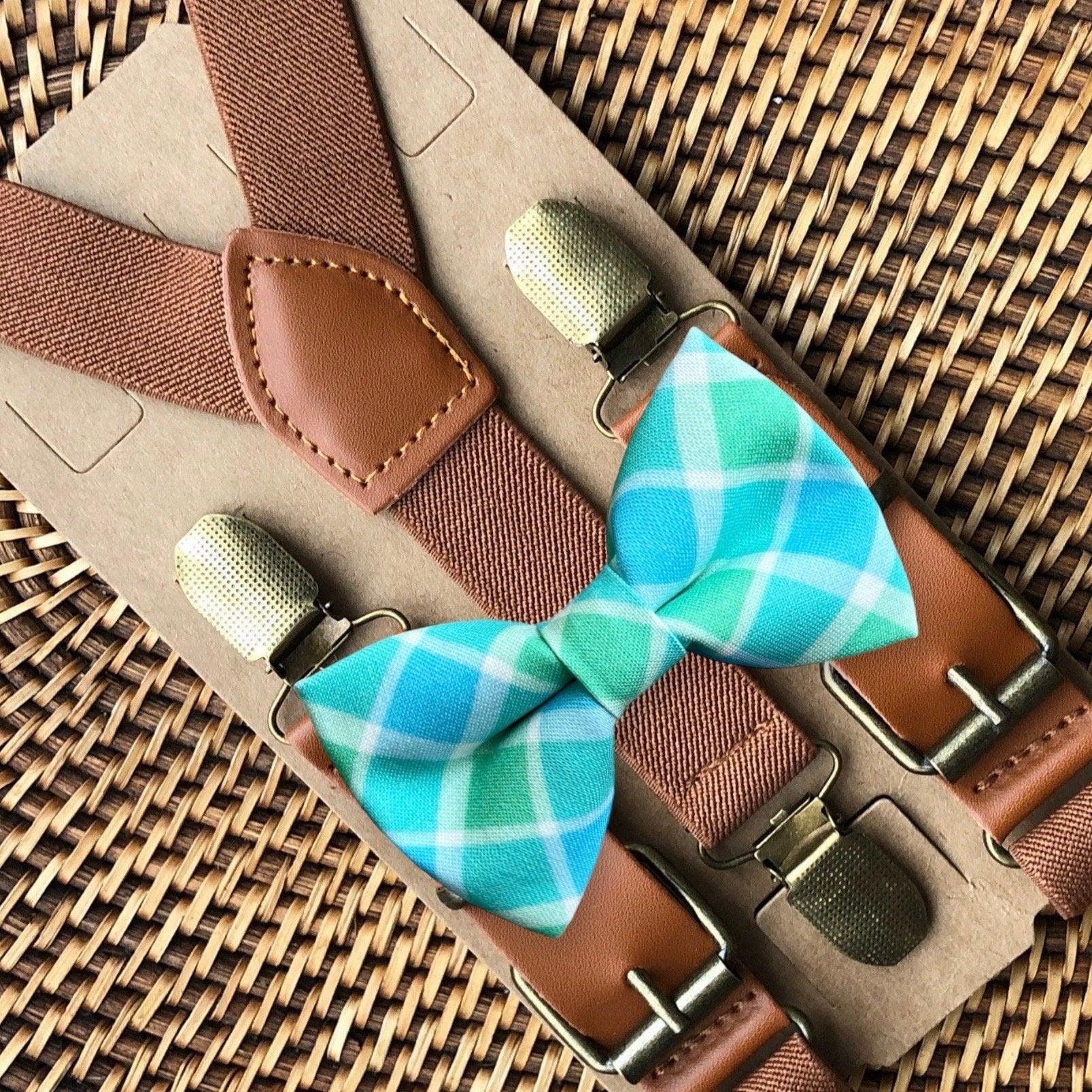 Size chart for suspender and bow tie sets from The Bold Bow Tie. X-Small (6mo-4yr): 15"-23" suspenders, 3.5" bow. Small (5-9yr): 18"-33" suspenders, 3.5" bow. Medium (10-12yr): 18"-33" suspenders, 4" bow. Adult (13yr-6'5"): 30"-53" suspenders, 4.5" bow. Big & Tall (Over 6'5"): 53"+ suspenders, 4.5" bow. Instructions note to measure from the back waistband over the shoulder to the front waistband for a comfortable fit.