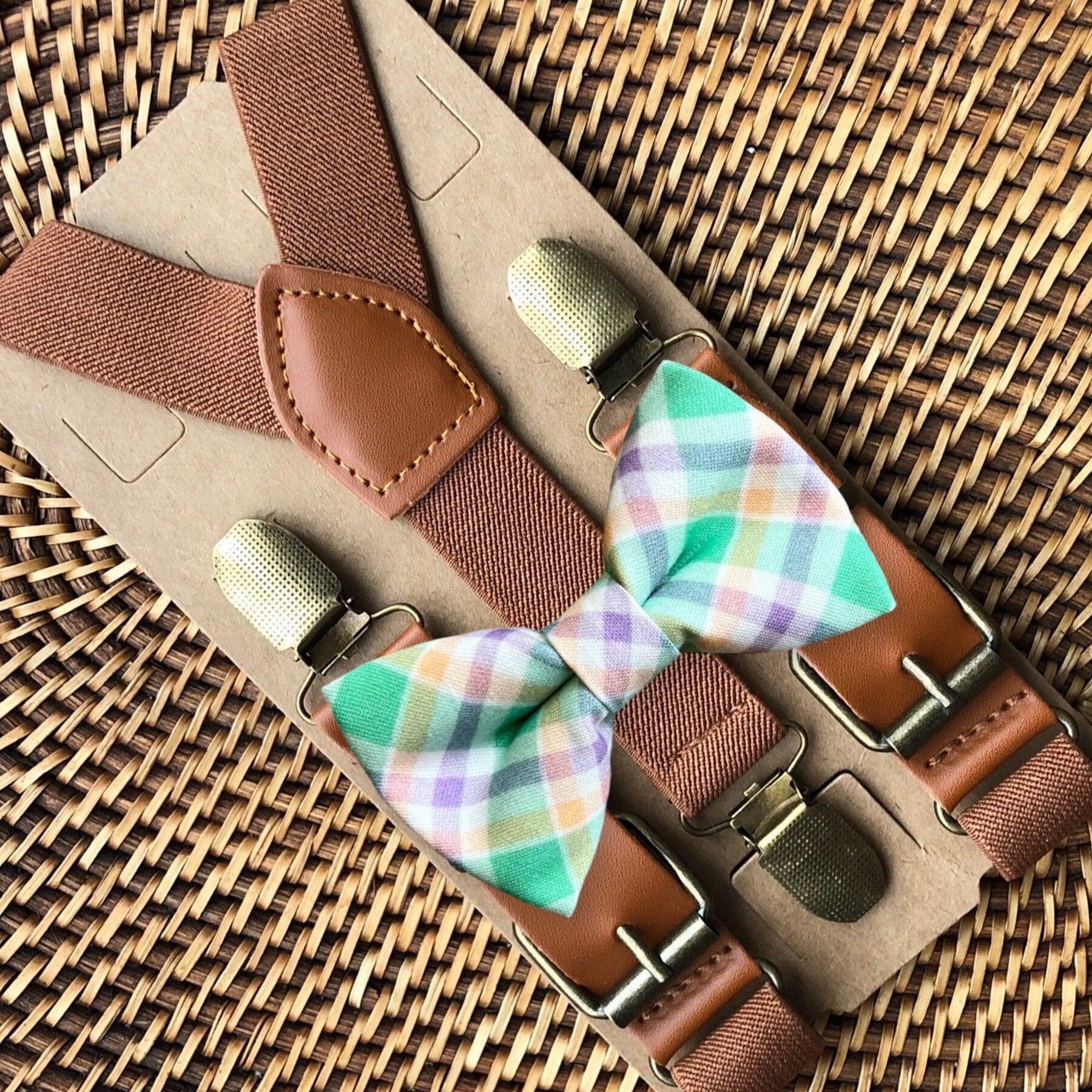 Size chart for suspender and bow tie sets from The Bold Bow Tie. X-Small (6mo-4yr): 15"-23" suspenders, 3.5" bow. Small (5-9yr): 18"-33" suspenders, 3.5" bow. Medium (10-12yr): 18"-33" suspenders, 4" bow. Adult (13yr-6'5"): 30"-53" suspenders, 4.5" bow. Big & Tall (Over 6'5"): 53"+ suspenders, 4.5" bow. Instructions note to measure from the back waistband over the shoulder to the front waistband for a comfortable fit.