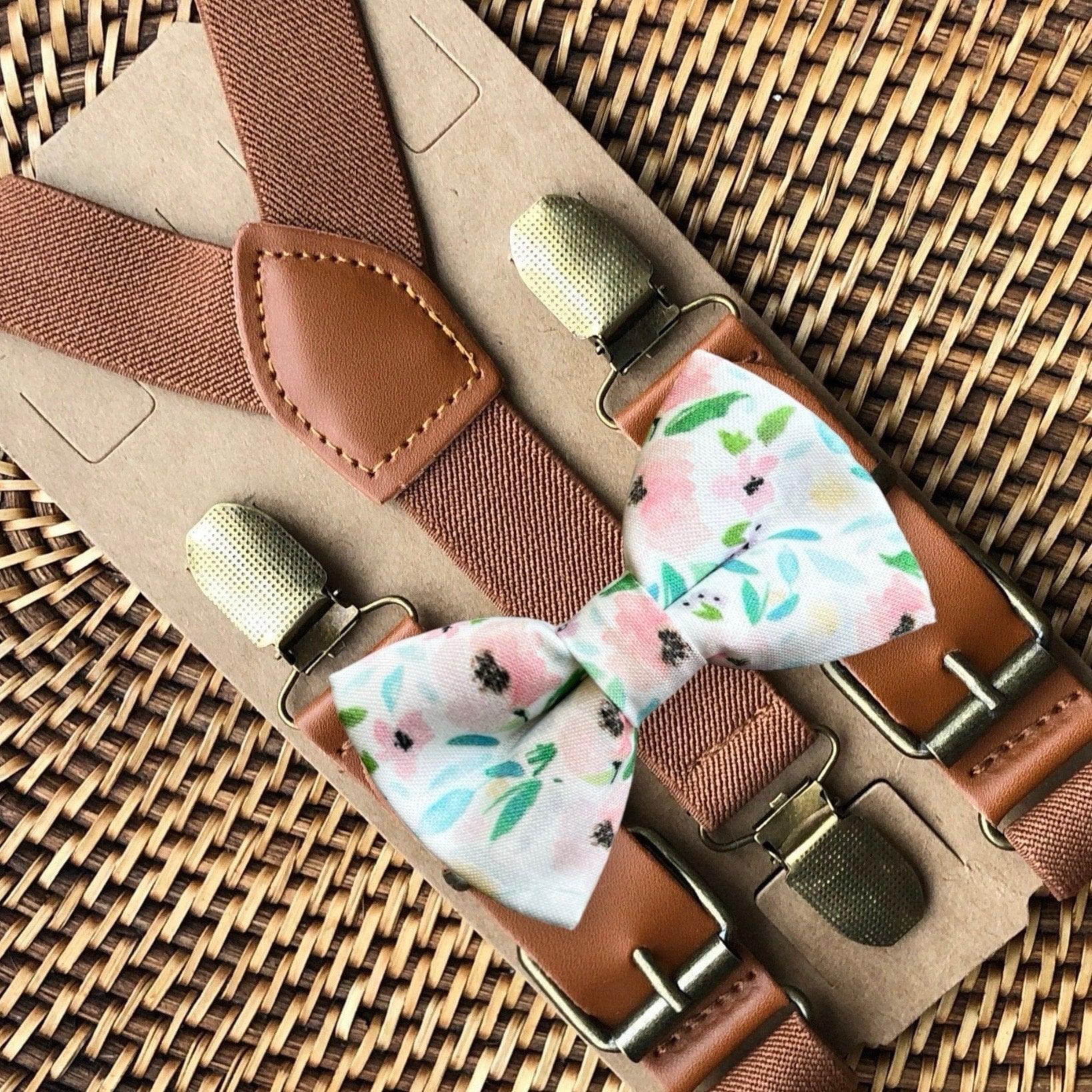 Size chart for suspender and bow tie sets from The Bold Bow Tie. X-Small (6mo-4yr): 15"-23" suspenders, 3.5" bow. Small (5-9yr): 18"-33" suspenders, 3.5" bow. Medium (10-12yr): 18"-33" suspenders, 4" bow. Adult (13yr-6'5"): 30"-53" suspenders, 4.5" bow. Big & Tall (Over 6'5"): 53"+ suspenders, 4.5" bow. Instructions note to measure from the back waistband over the shoulder to the front waistband for a comfortable fit.