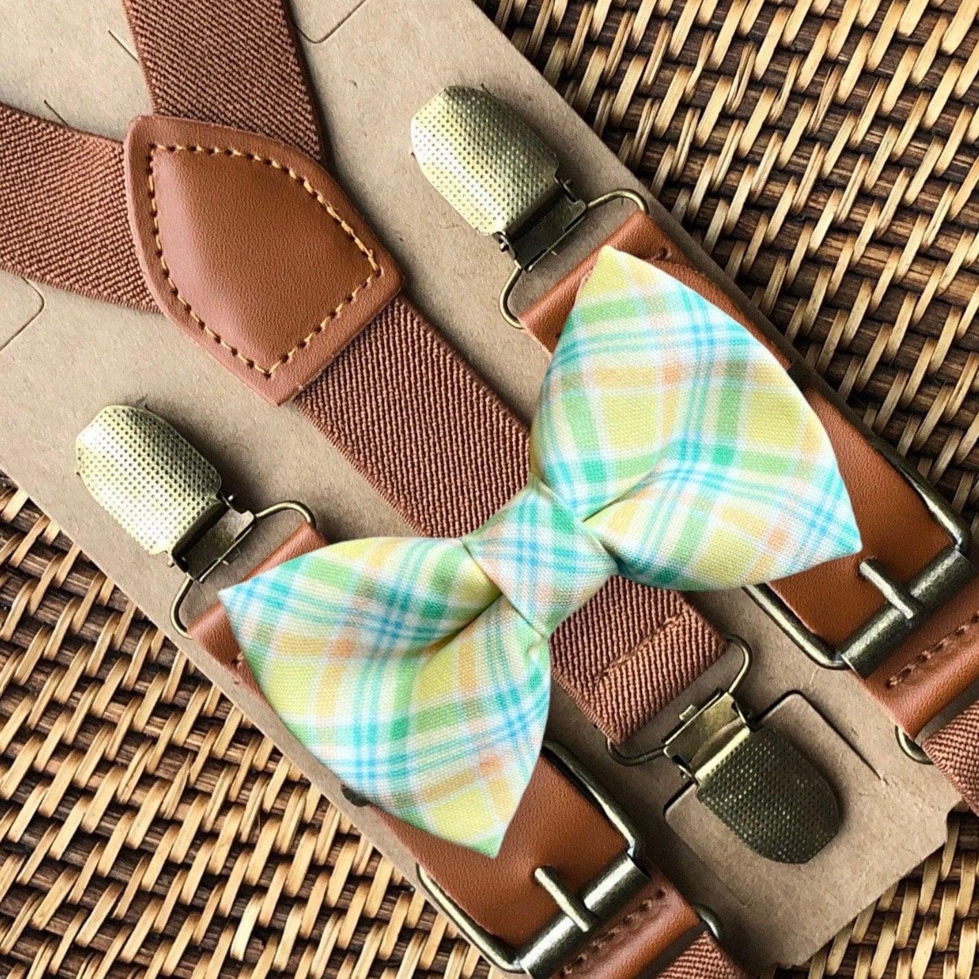 Size chart for suspender and bow tie sets from The Bold Bow Tie. X-Small (6mo-4yr): 15"-23" suspenders, 3.5" bow. Small (5-9yr): 18"-33" suspenders, 3.5" bow. Medium (10-12yr): 18"-33" suspenders, 4" bow. Adult (13yr-6'5"): 30"-53" suspenders, 4.5" bow. Big & Tall (Over 6'5"): 53"+ suspenders, 4.5" bow. Instructions note to measure from the back waistband over the shoulder to the front waistband for a comfortable fit.