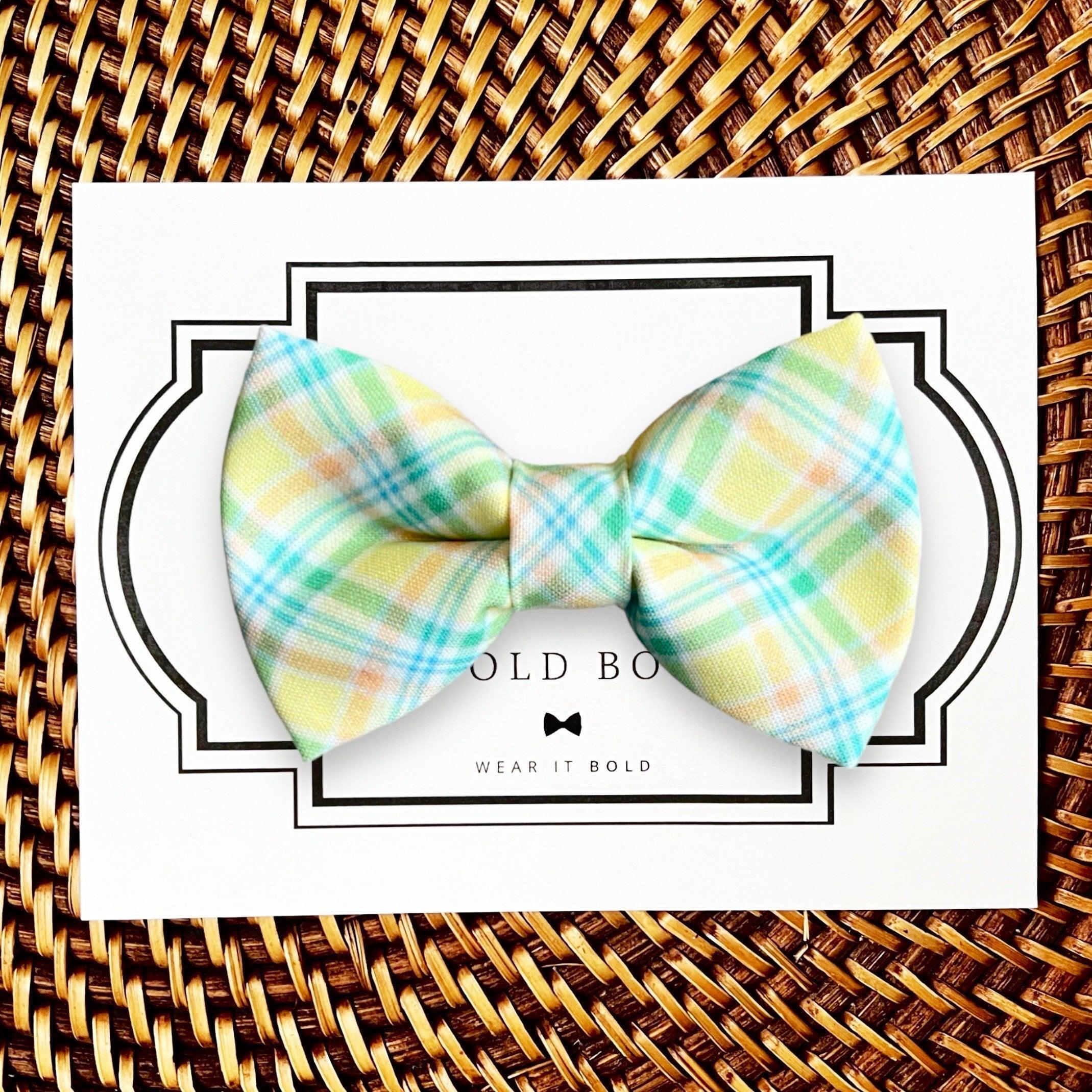 Dog bow tie size chart. Size Small is 3 1/2 inches wide for small dogs under 15 lbs. Size Medium is 4 inches wide for medium dogs between 15 band 40 lbs. Size Large is 4 1/2 inches wide for Large Dogs between 40 band 80 lbs. Size Extra Large is 5 1/2 inches wide for Extra Large Dogs over 80 lbs. Sizing is up to preference and pet bow ties slide on to dog collars with elastic.