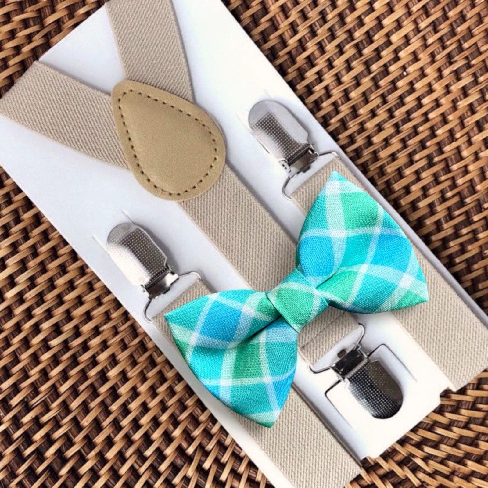Bow tie and suspenders set with blue plaid design on a woven surface for Easter.
