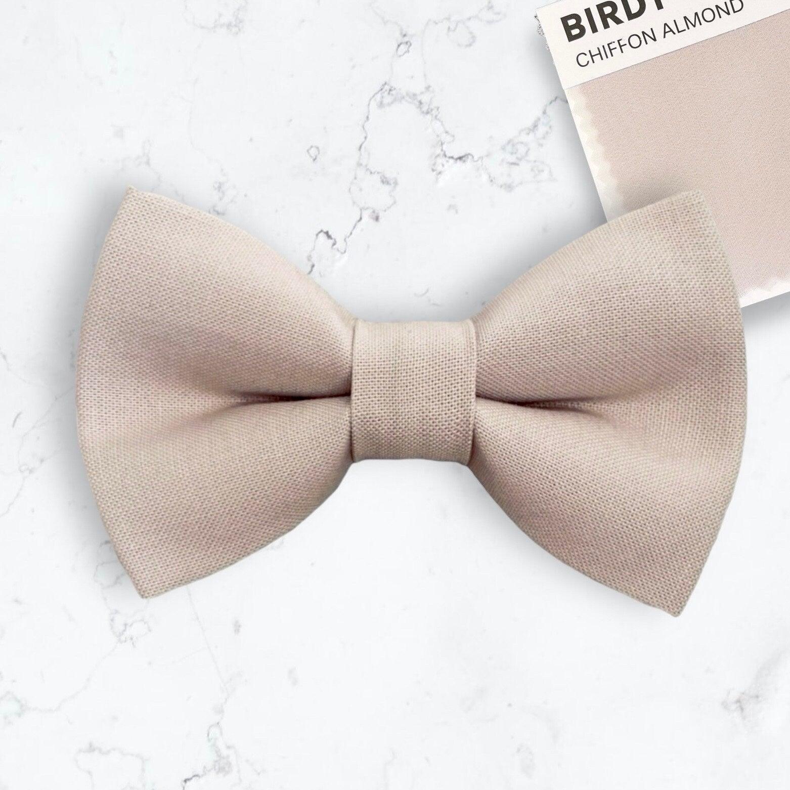 Size chart for suspender and bow tie sets from The Bold Bow Tie. X-Small (6mo-4yr): 15"-23" suspenders, 3.5" bow. Small (5-9yr): 18"-33" suspenders, 3.5" bow. Medium (10-12yr): 18"-33" suspenders, 4" bow. Adult (13yr-6'5"): 30"-53" suspenders, 4.5" bow. Big & Tall (Over 6'5"): 53"+ suspenders, 4.5" bow. Instructions note to measure from the back waistband over the shoulder to the front waistband for a comfortable fit.