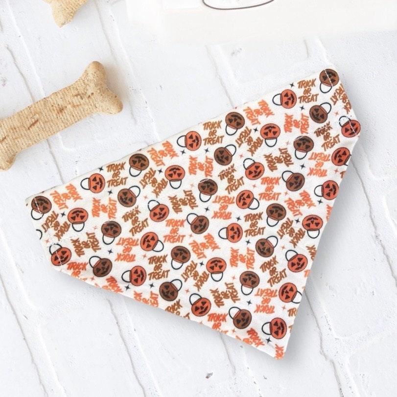 Halloween dog or cat bandana with pumpkin icons and Trick or Treat text on white fabric