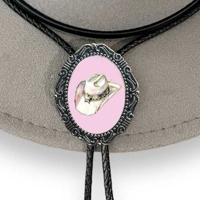 Bolo tie with pink center and cowboy hat design on a gray hat
