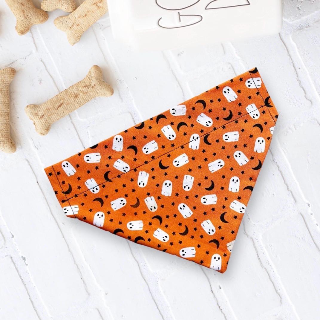 Orange Halloween ghost dog bandana with white ghosts and black crescent moons