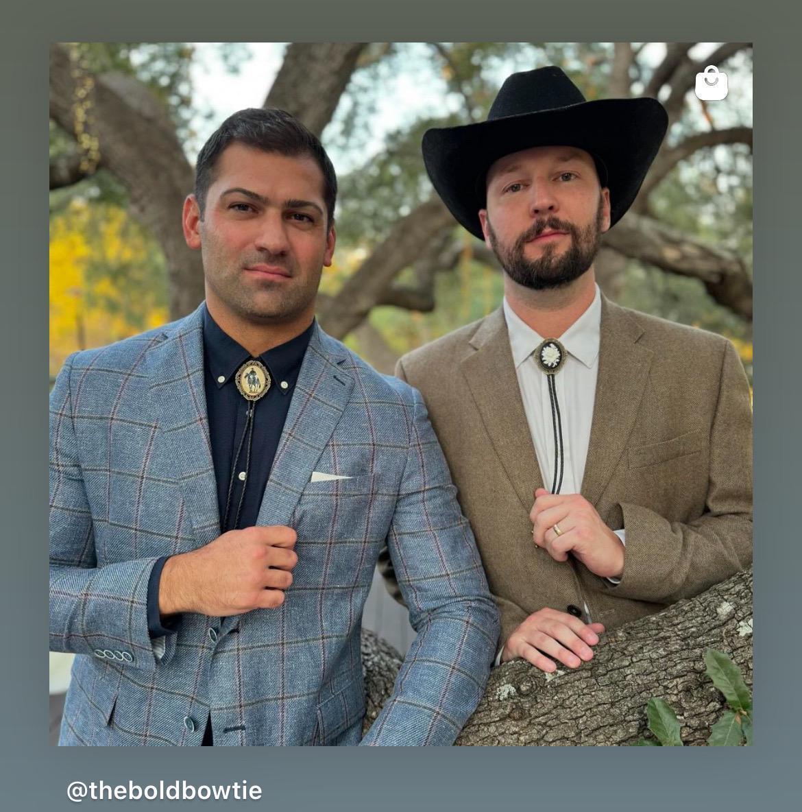 Two men in western attire modeling bolo ties; one in a blue plaid suit and the other in a tan blazer with a black cowboy hat.